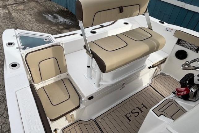2026 Yamaha Boats 222 FSH Sport E interior with beige seating and FSH-branded flooring.