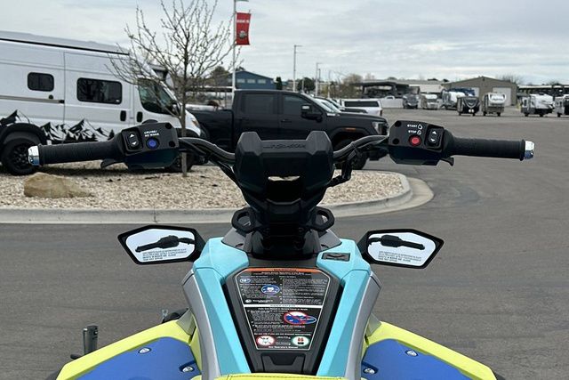 Yamaha WaveRunner JETBLASTER PRO 3 in blue and yellow on a parking lot.