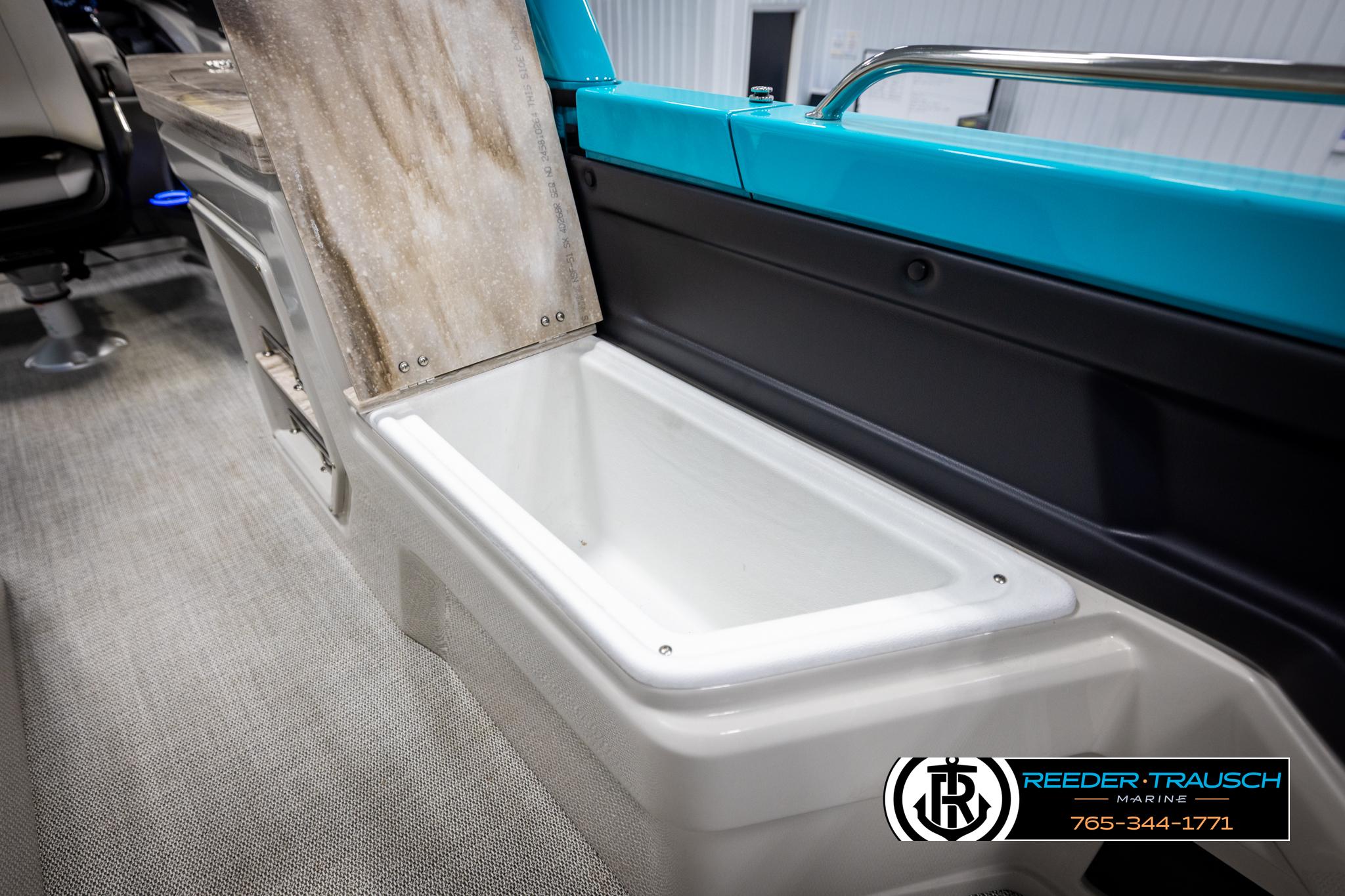 2025 Avalon 2585 Excal VRBW boat interior storage compartment, open lid, modern design.