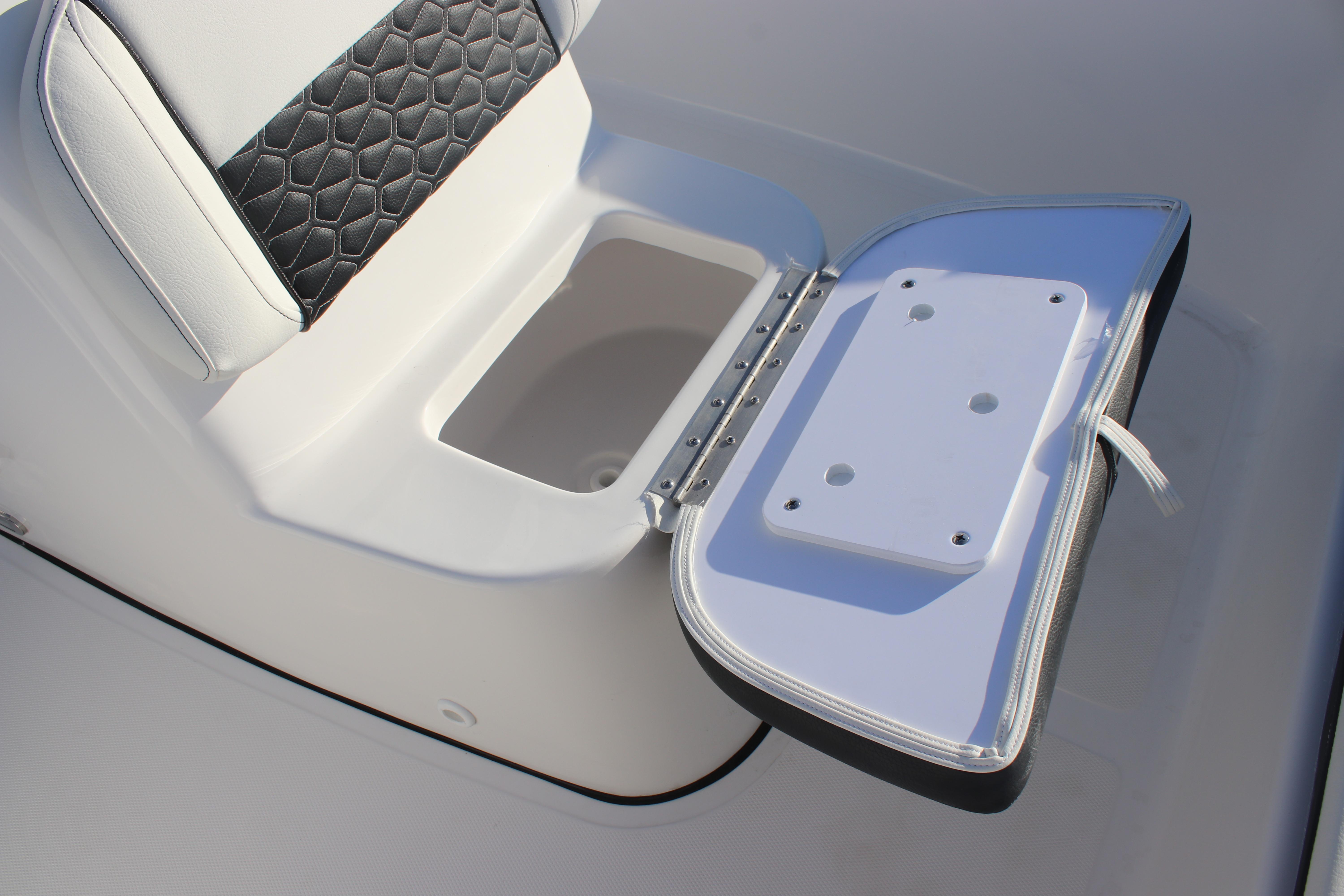 2026 Tidewater 180 CC Adventure boat seat with open storage compartment.
