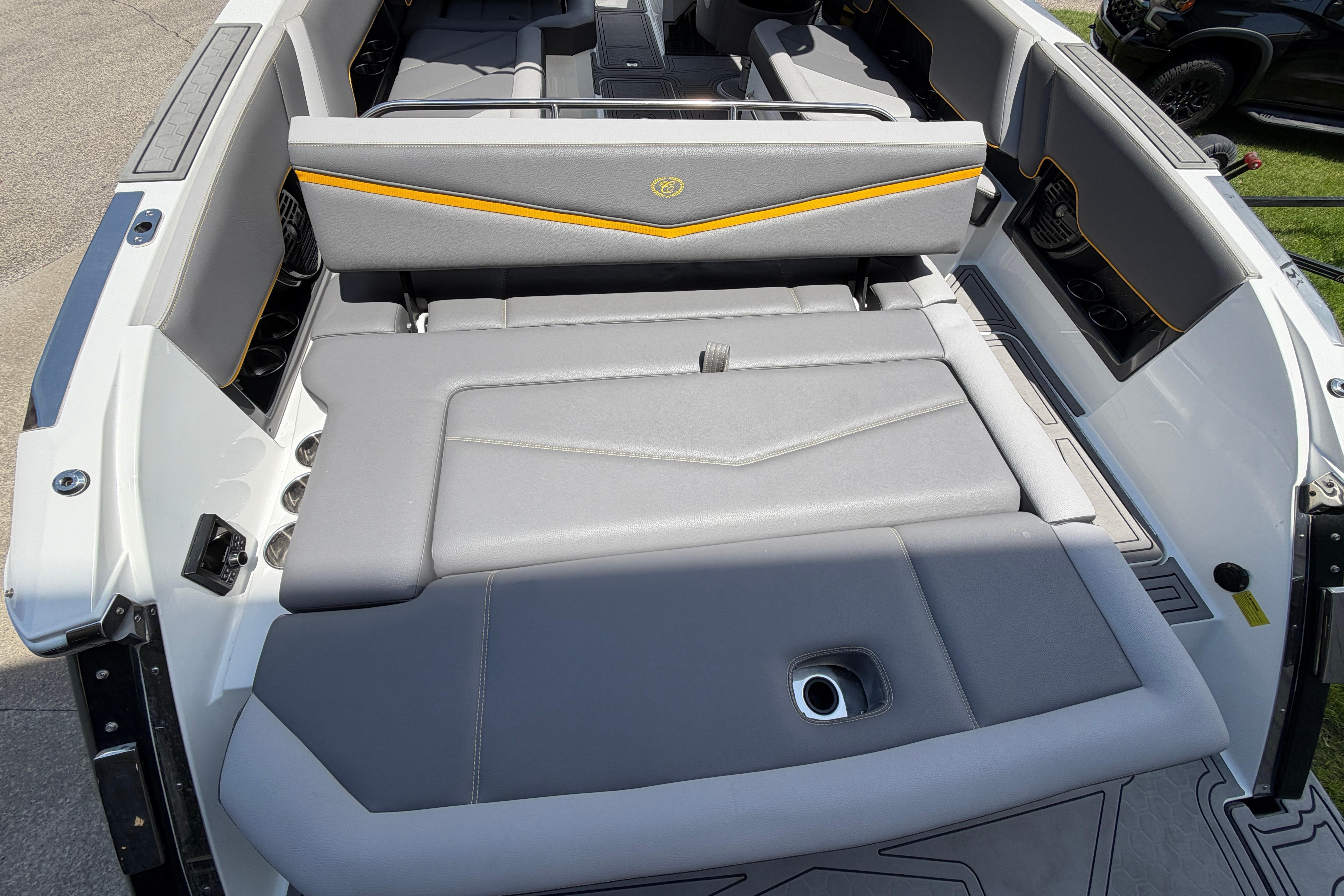 The image shows the stern of a 2021 Cobalt R8 Surf boat with gray upholstery.