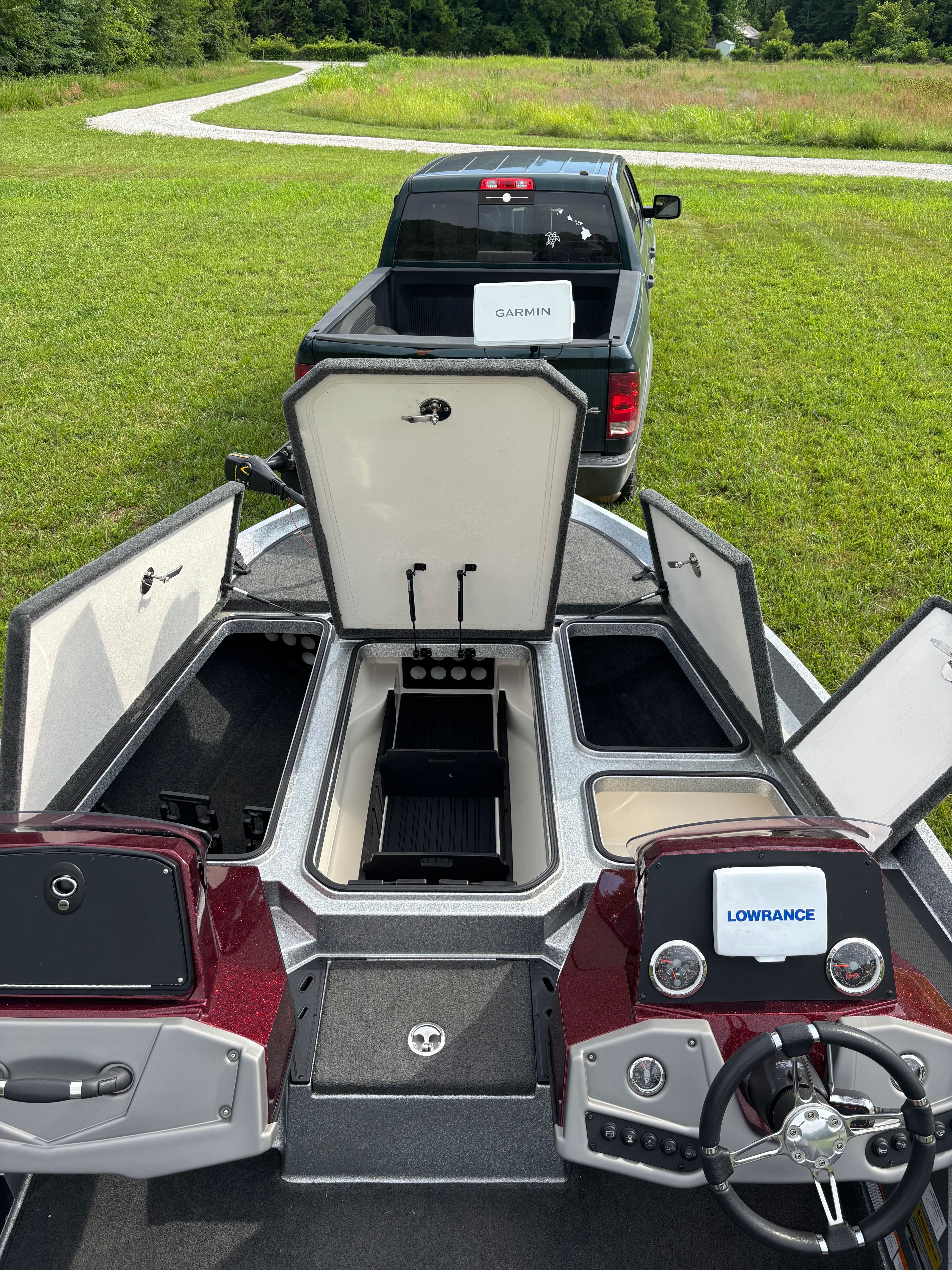 A 2016 Ranger Z 185 boat on a trailer, with storage compartments open.