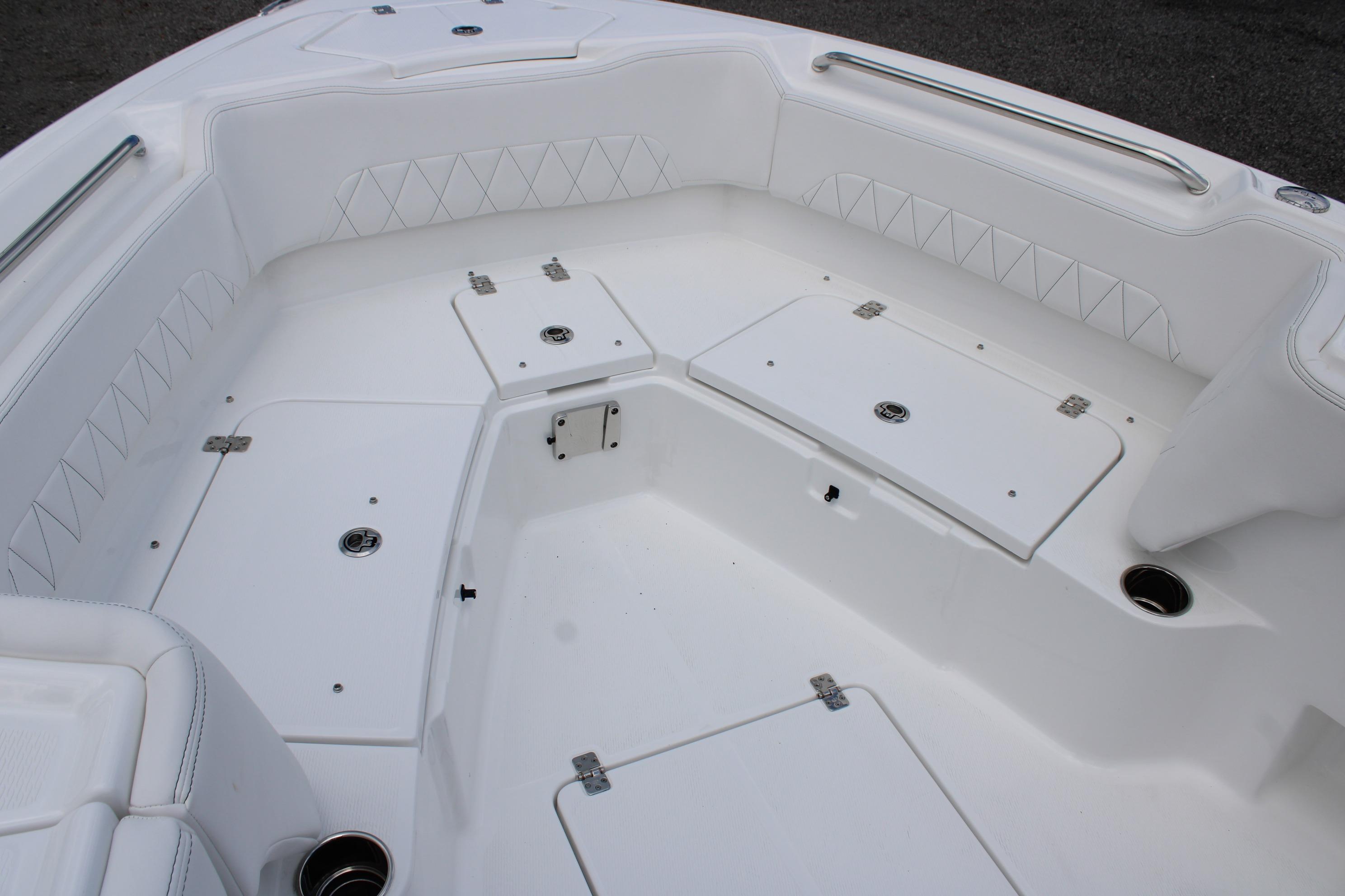 2027 Blazer Bay Makaira 2800 boat interior with white seating and storage compartments.