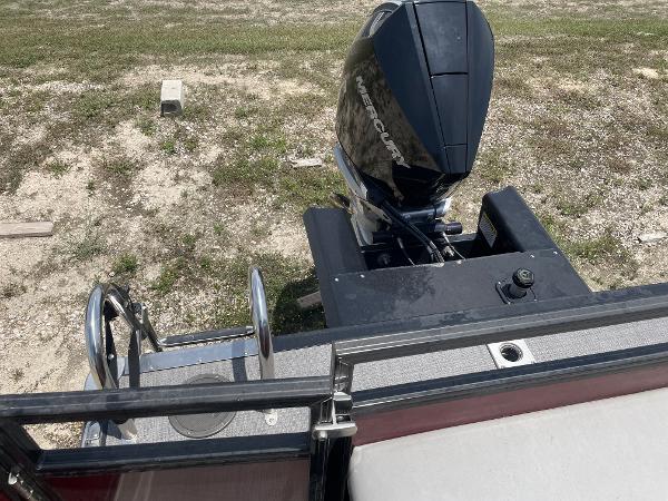 2023 Regency 250 DL3 boat with Mercury outboard motor, viewed from the deck.