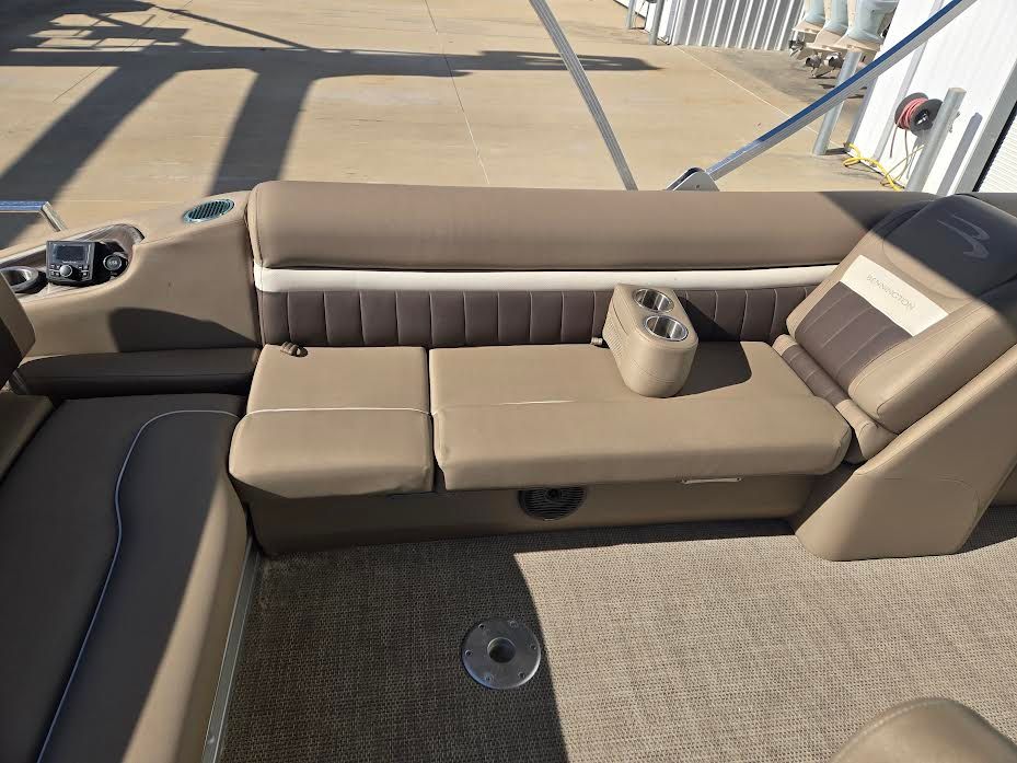 Interior of a 2021 Bennington LX24SBSD pontoon boat with beige seating.