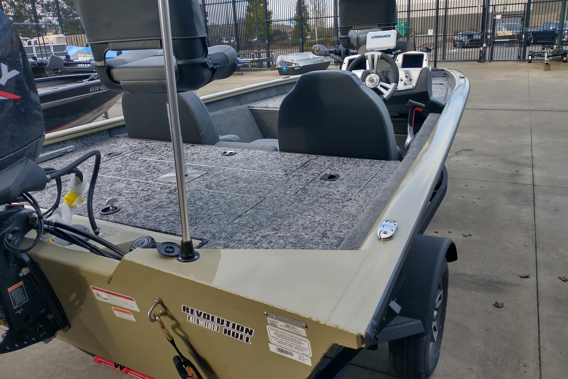 2026 Tracker Pro Team 175 boat with modern features, parked outdoors.