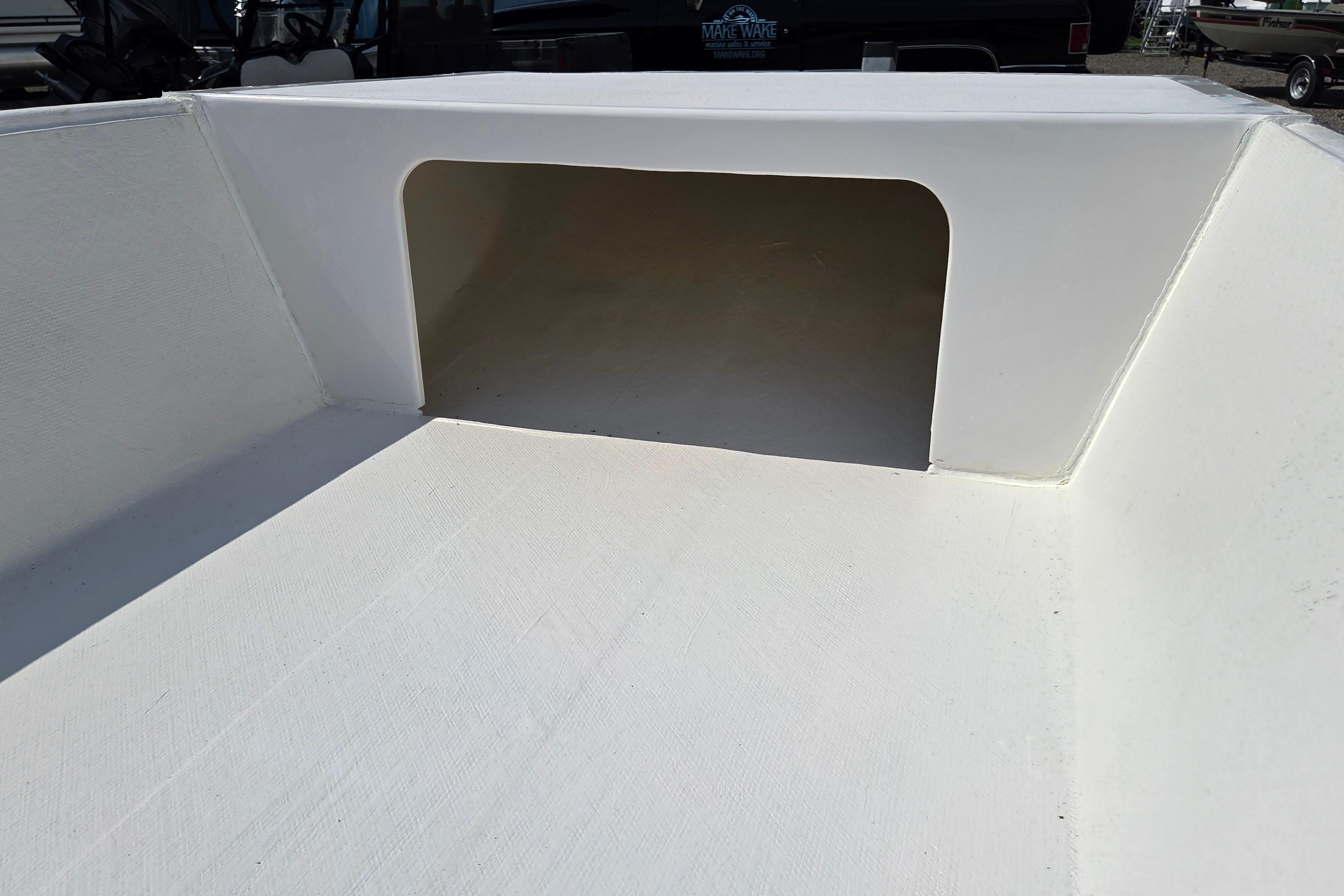 Interior view of 2027 Delta Boatworks 1550, showcasing storage compartment.