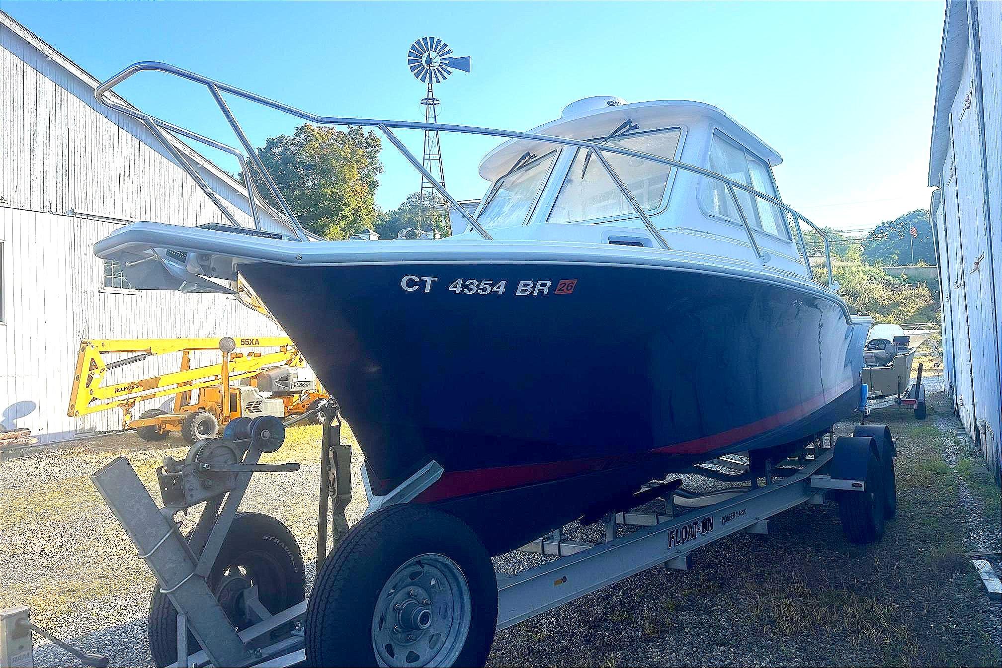 2024 NorthCoast 235 HT boat on trailer, side view.