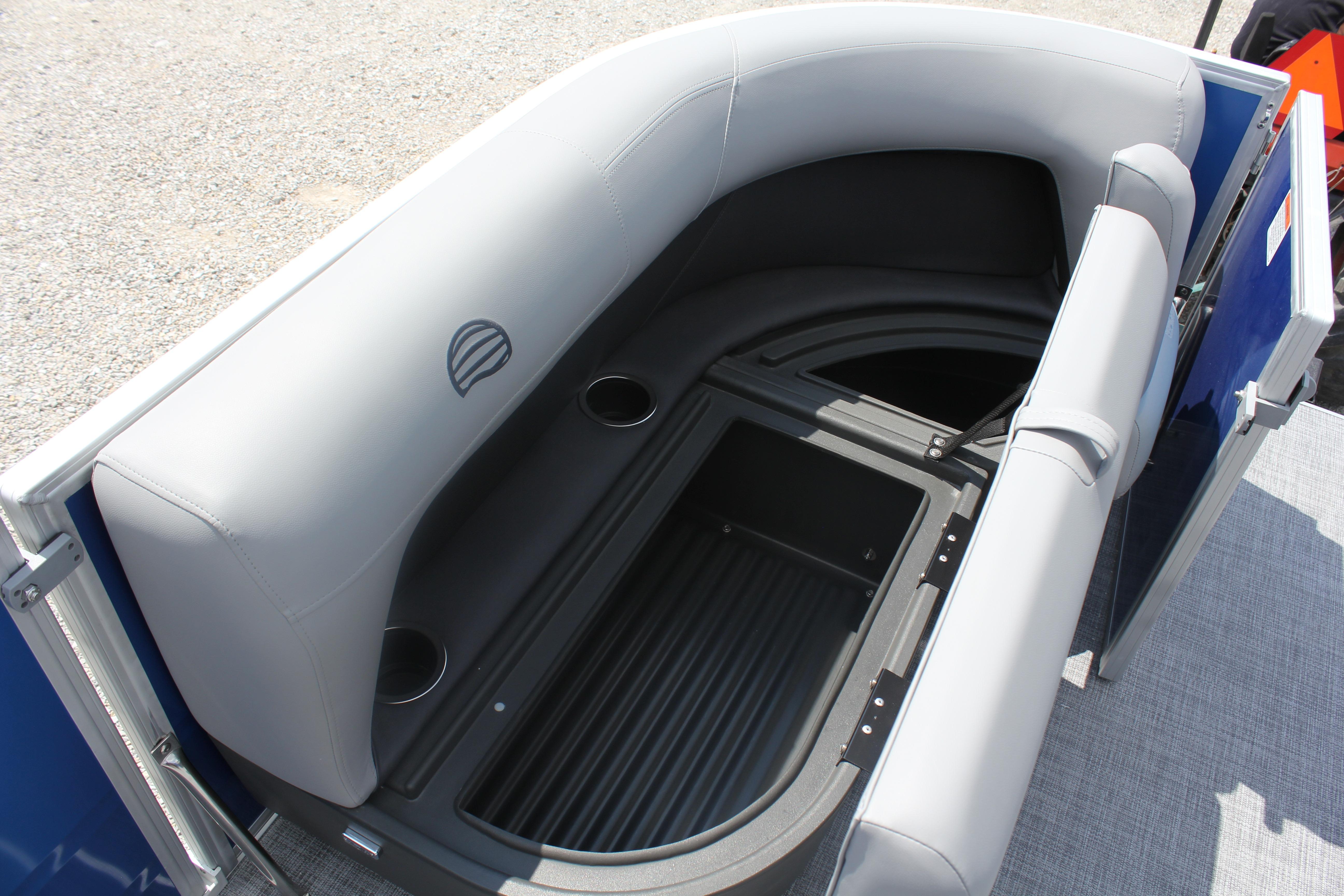 2026 Sun Tracker Party Barge 16 DLX seating with storage and cup holders.