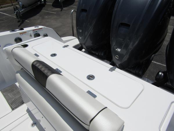 2024 Wellcraft 352 Fisherman boat with dual outboard engines and cushioned seating.
