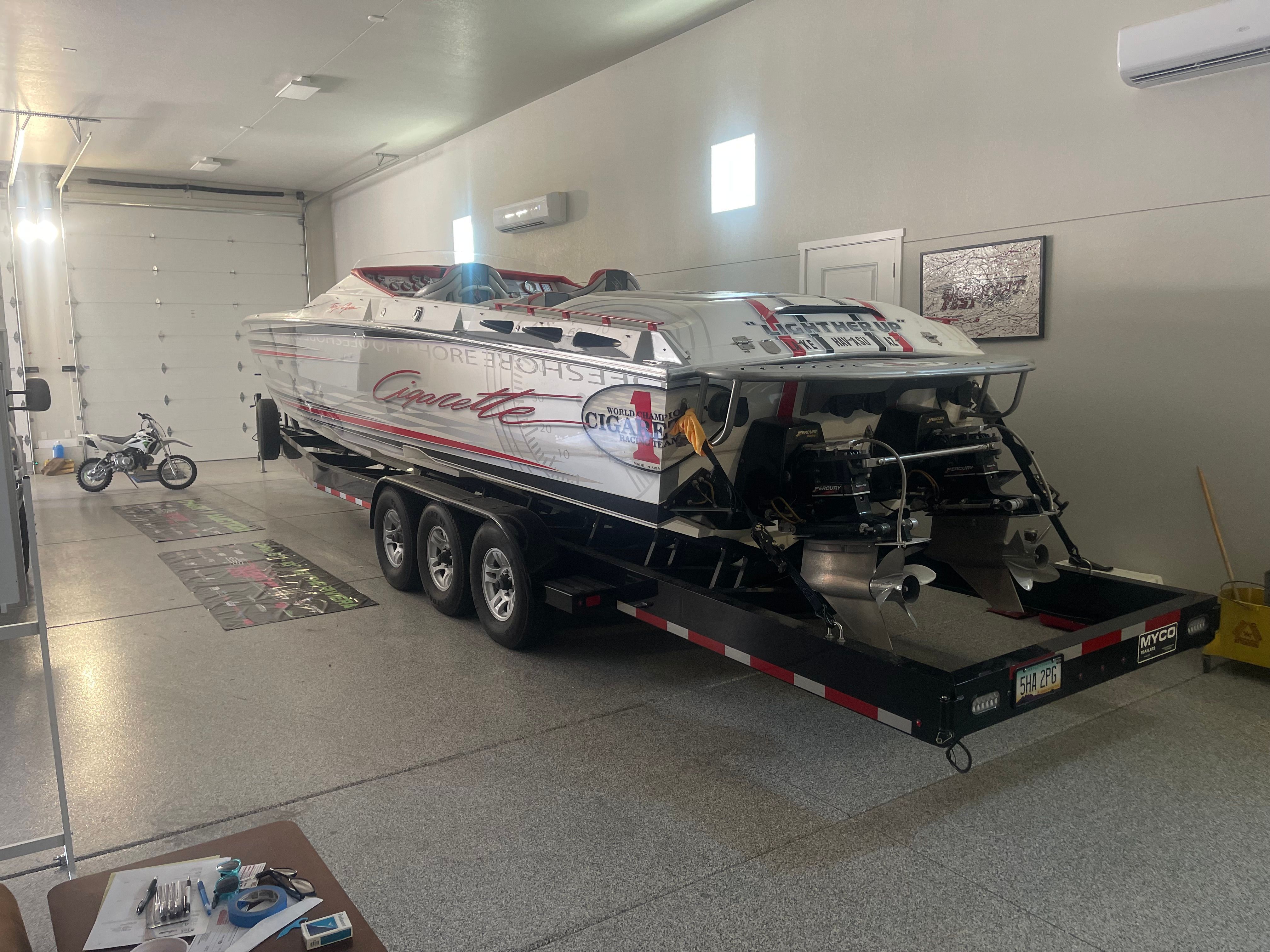 2004 Cigarette 38' Top Gun boat in garage on trailer