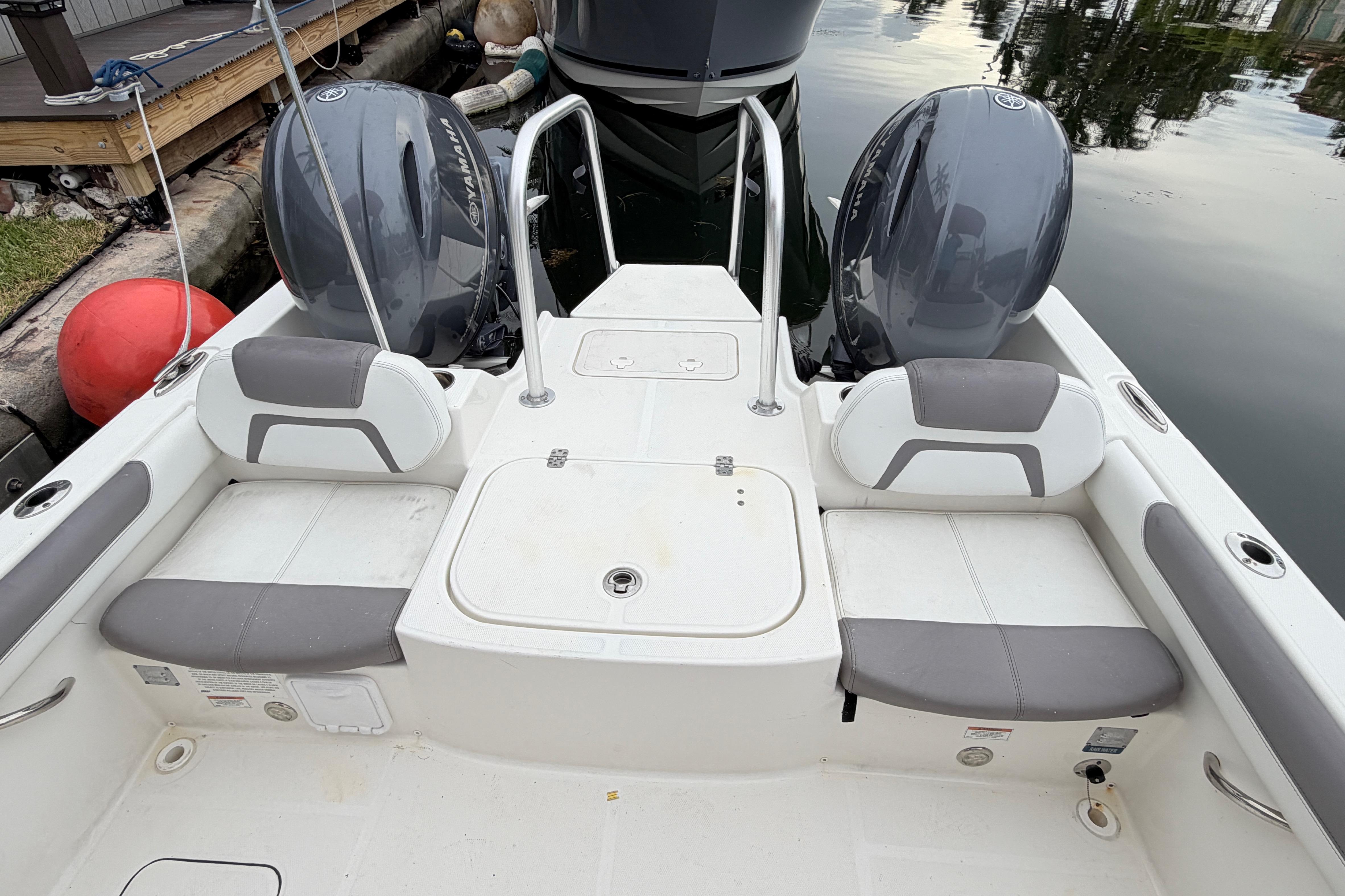 2019 World Cat 230 DC boat interior with dual engines and seating.