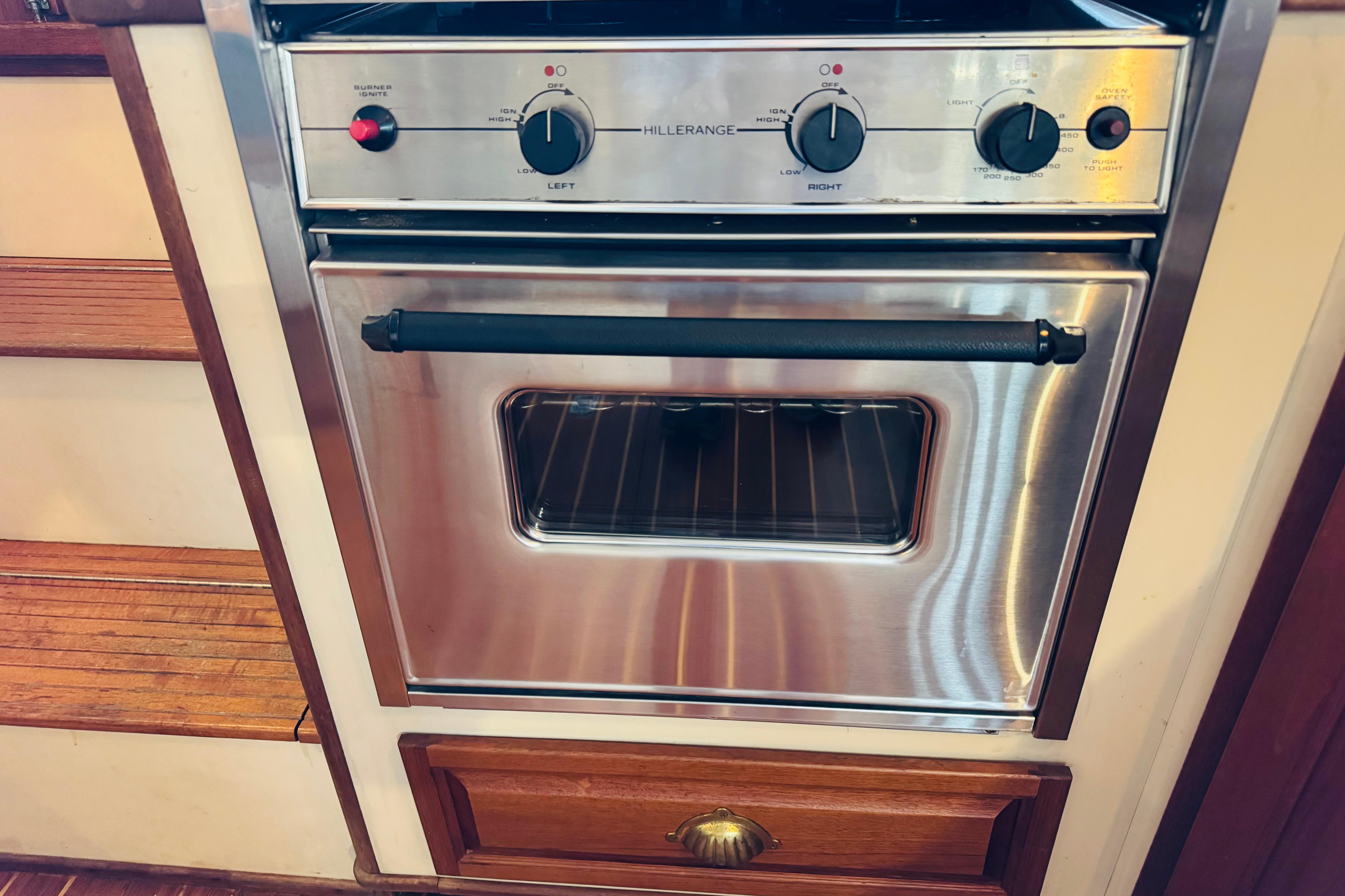 Stainless steel oven in a 1996 Nordic Tug 32 boat kitchen.