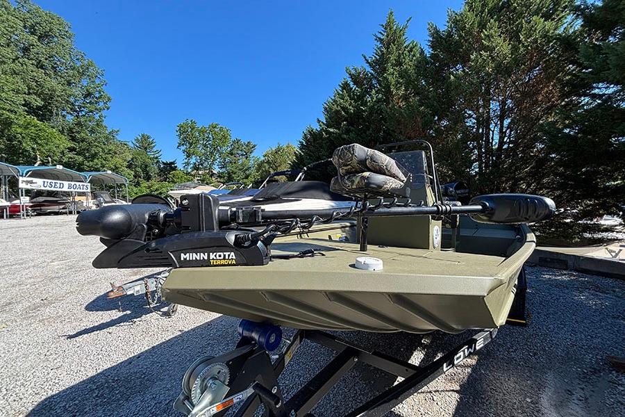 2022 Lowe Roughneck 1660 boat with Minn Kota Terrova motor, parked outdoors.