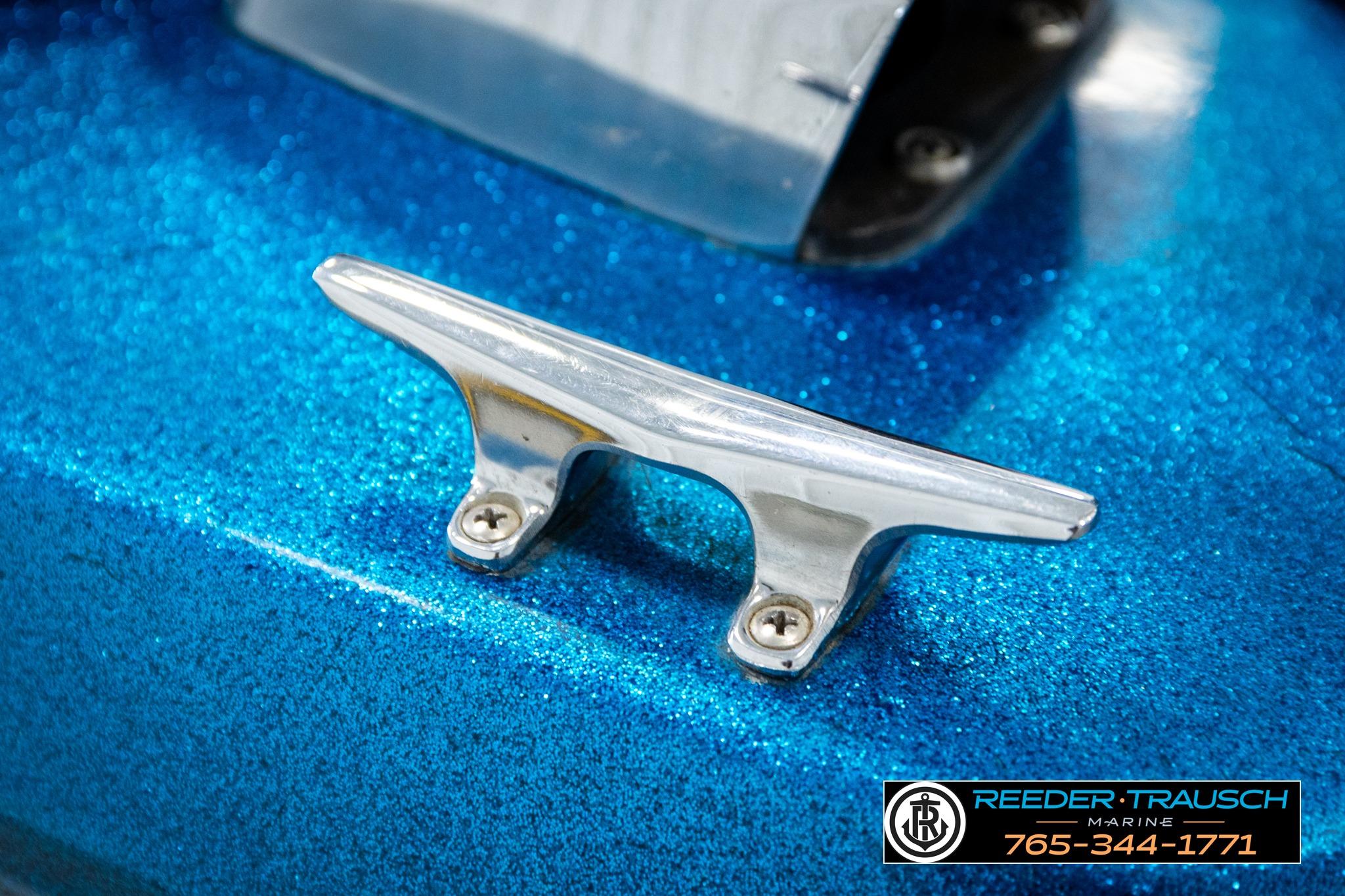 Chrome cleat on blue 1980 Ranger 175 VS boat, Reeder-Trausch Marine branding.