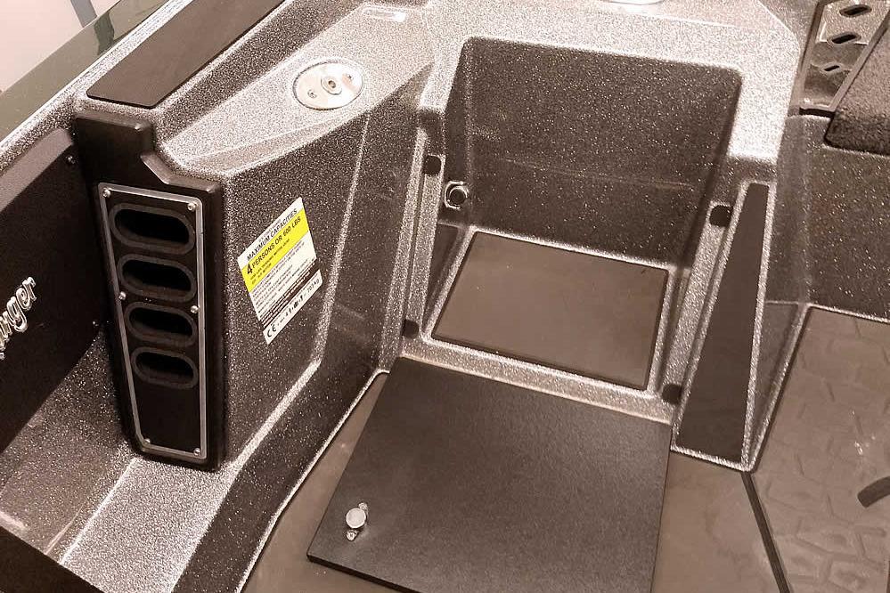 Interior of 2026 Ranger Z519R Cup-Equipped boat, featuring storage compartments and cup holders.