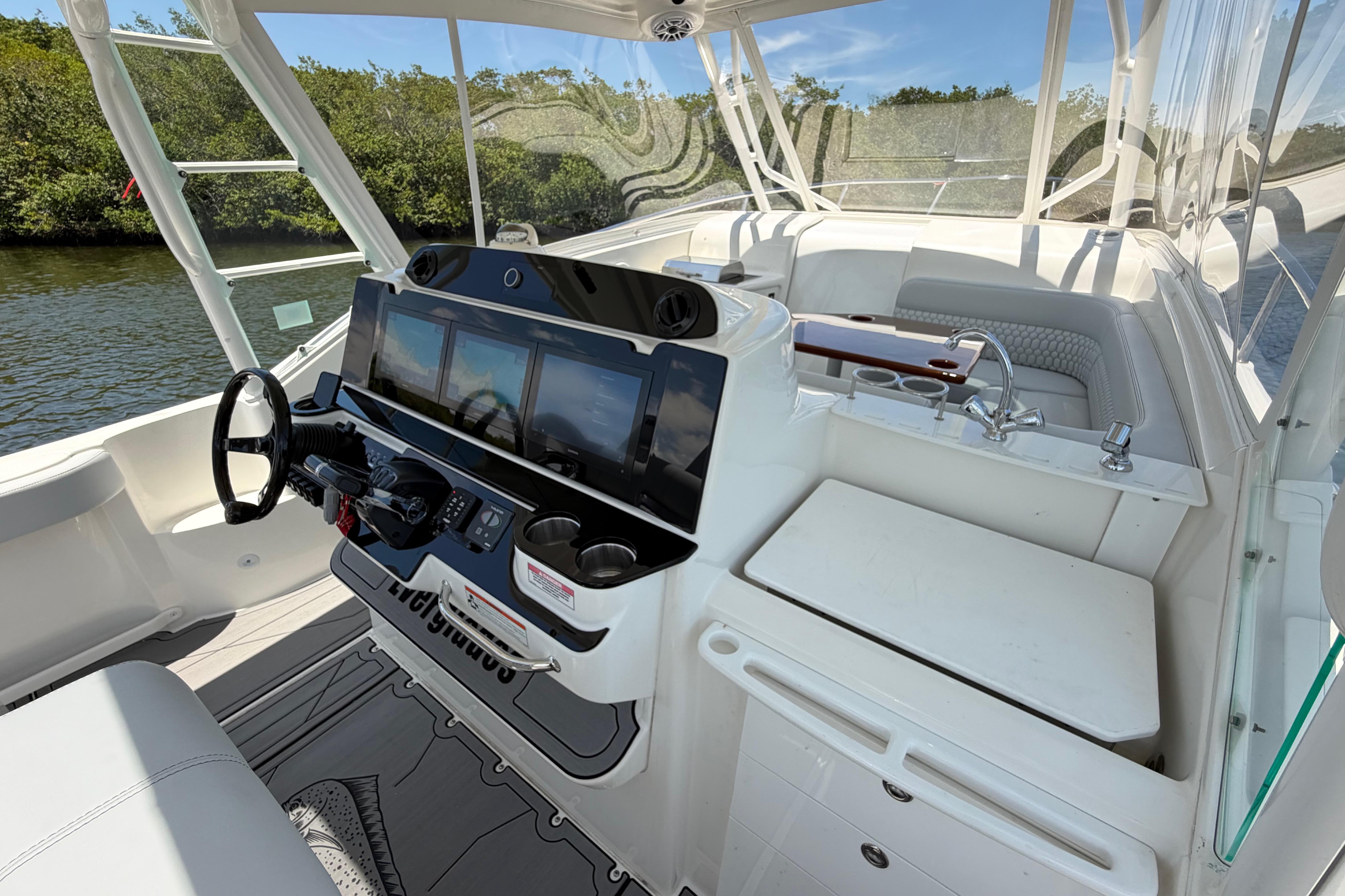 Cockpit of 2009 Everglades 350LX boat with modern controls and seating.