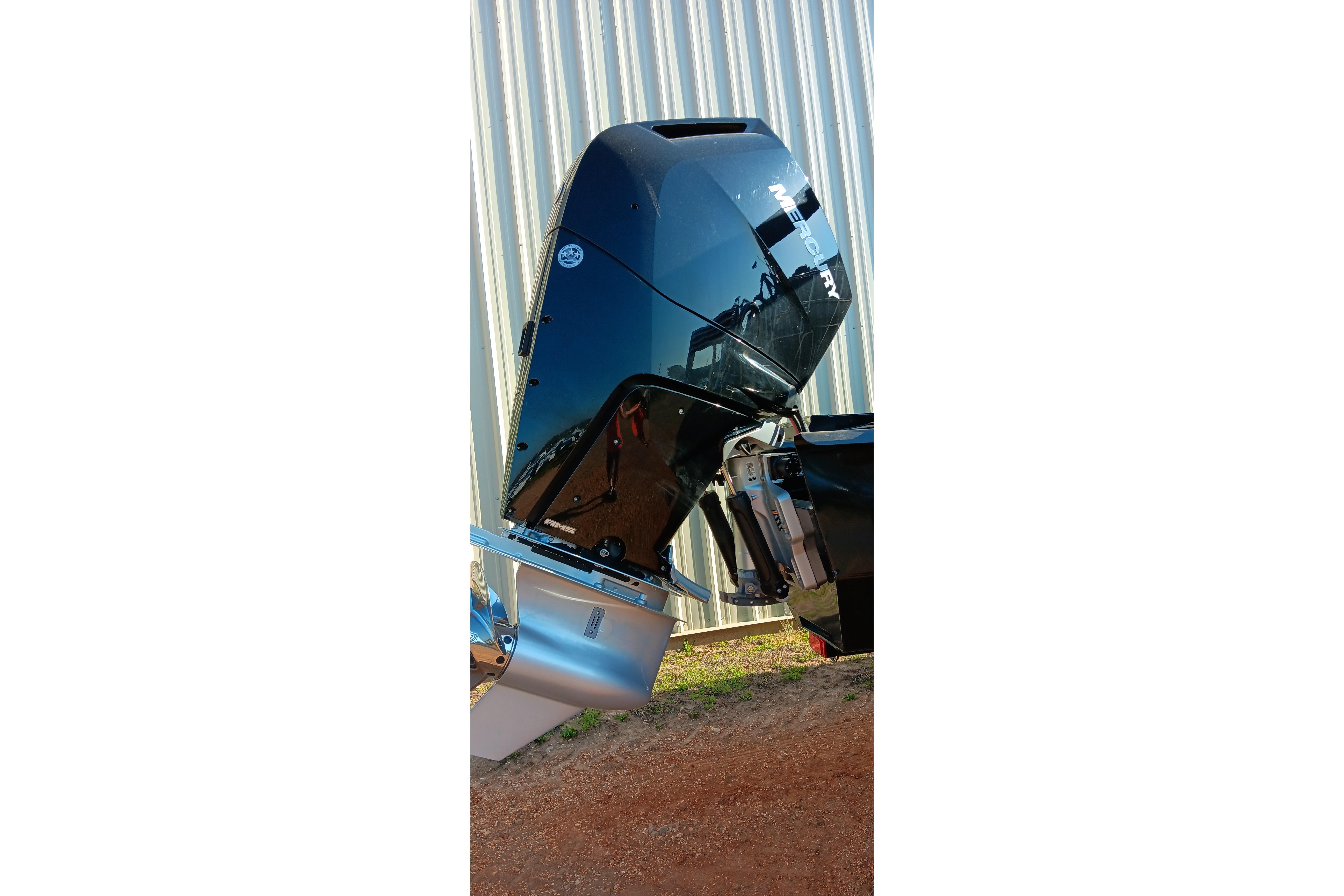 2023 Ranger 2500LS boat motor, Mercury engine, outdoors near corrugated metal wall.