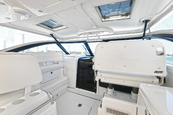 2008 Tiara Yachts 4200 Open interior with white seating and skylights.