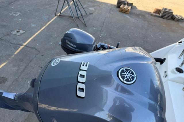 2017 Cutwater C-242 Coupe with Yamaha 300 outboard motor, docked on concrete surface.