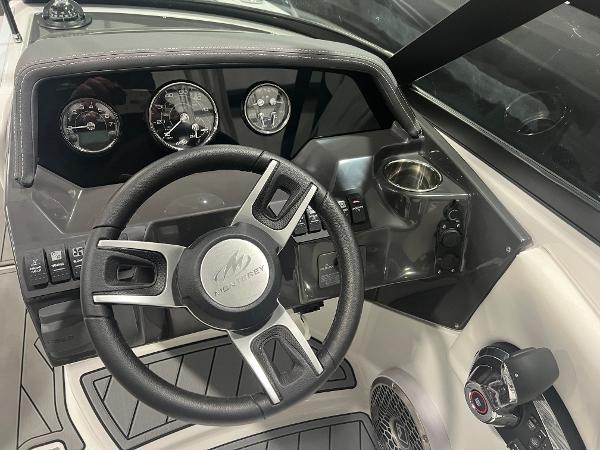 2024 Monterey M4 boat dashboard with steering wheel and gauges.