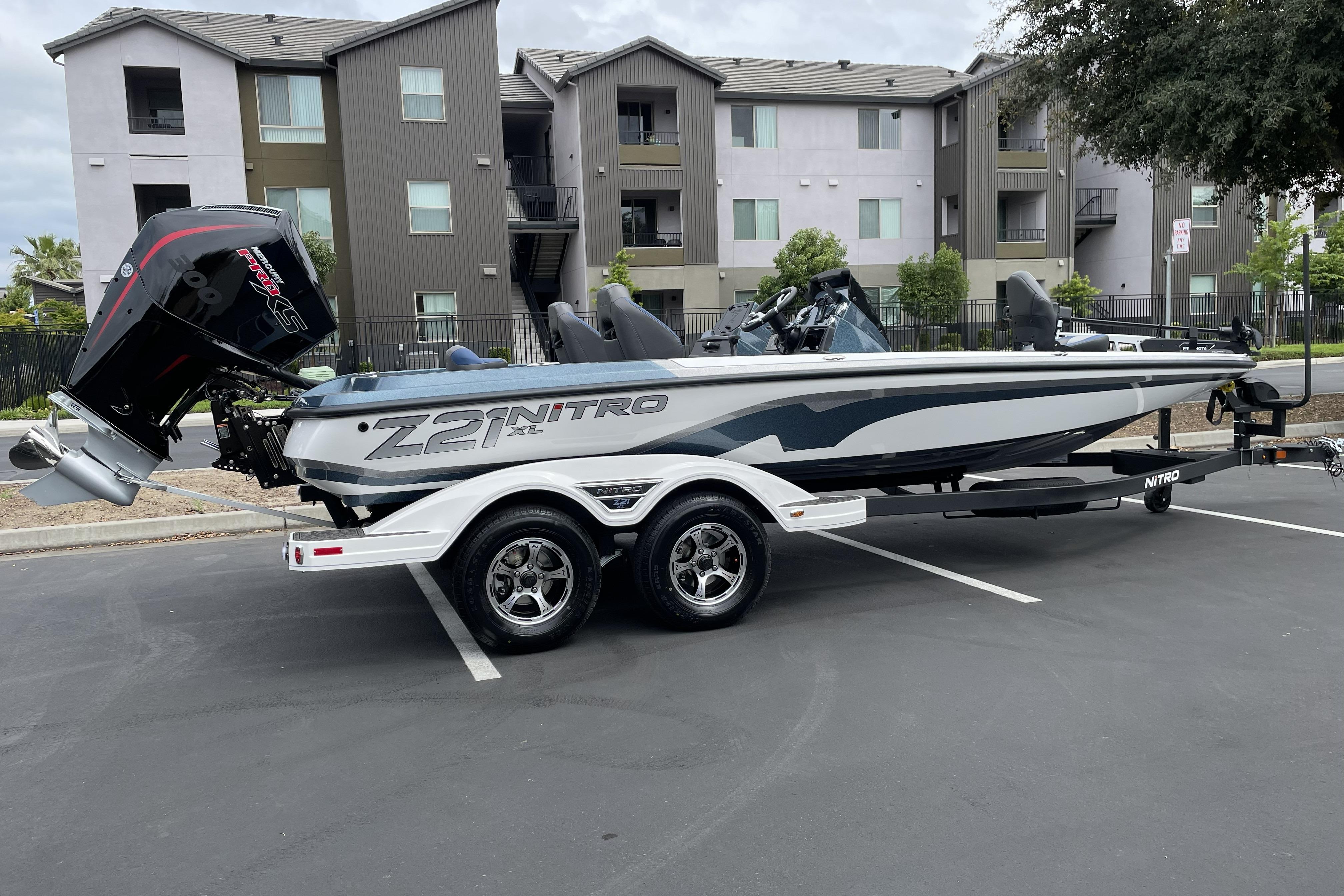 2026 Nitro Z21 XL boat parked in urban setting, showcasing sleek design and powerful engine.