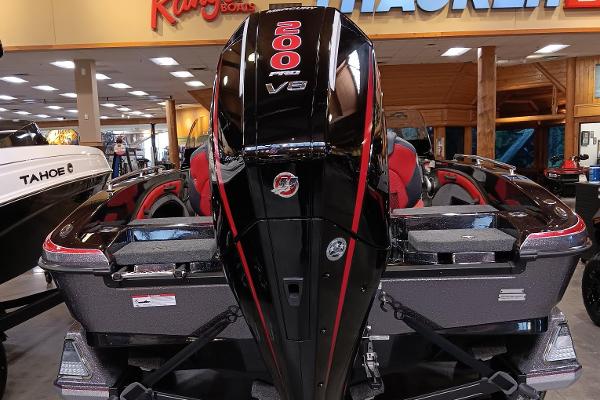 Ranger 1880MS 2025 boat with powerful 200 V6 engine displayed indoors.