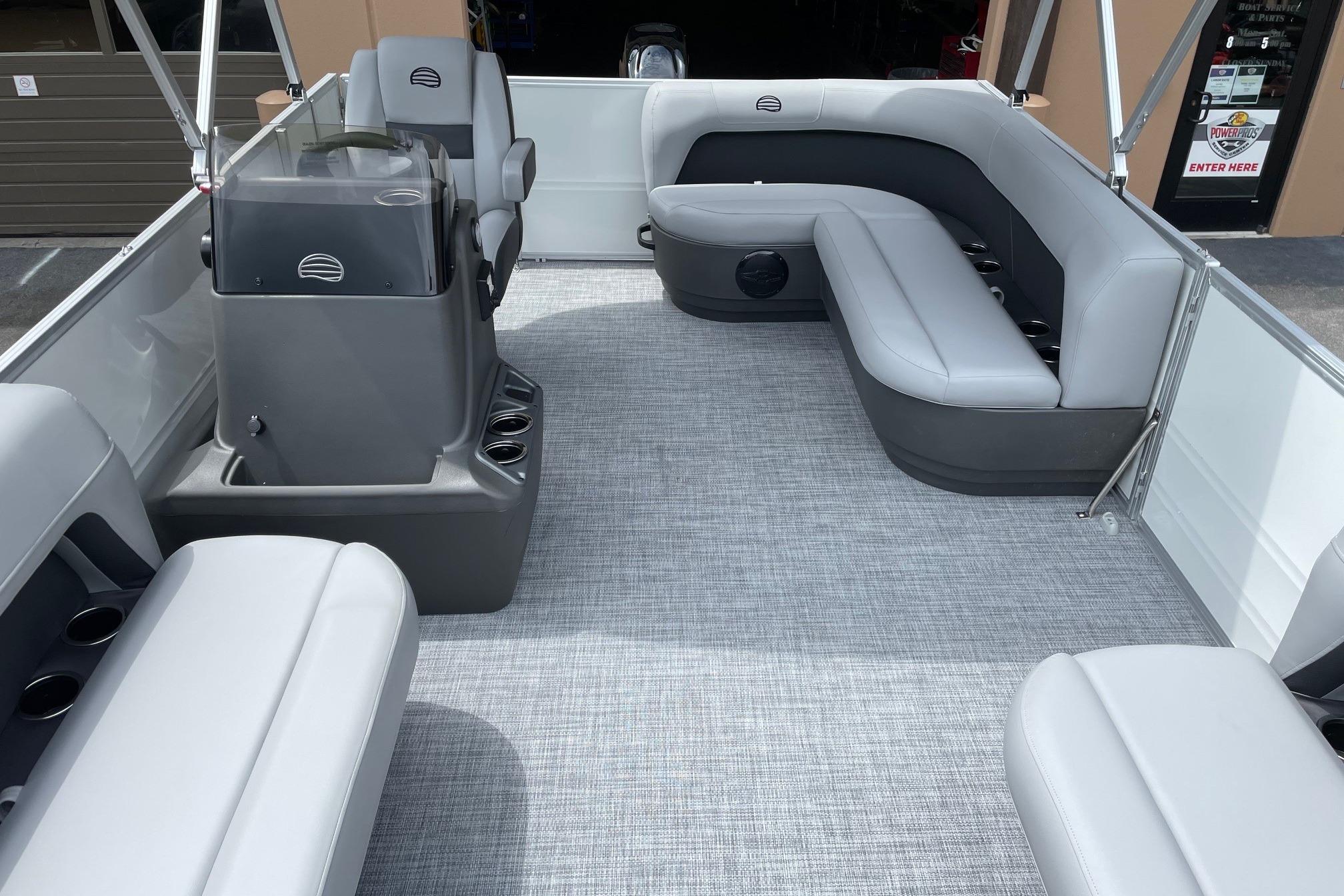 2026 Sun Tracker Party Barge 16 DLX interior with gray seating and modern design.