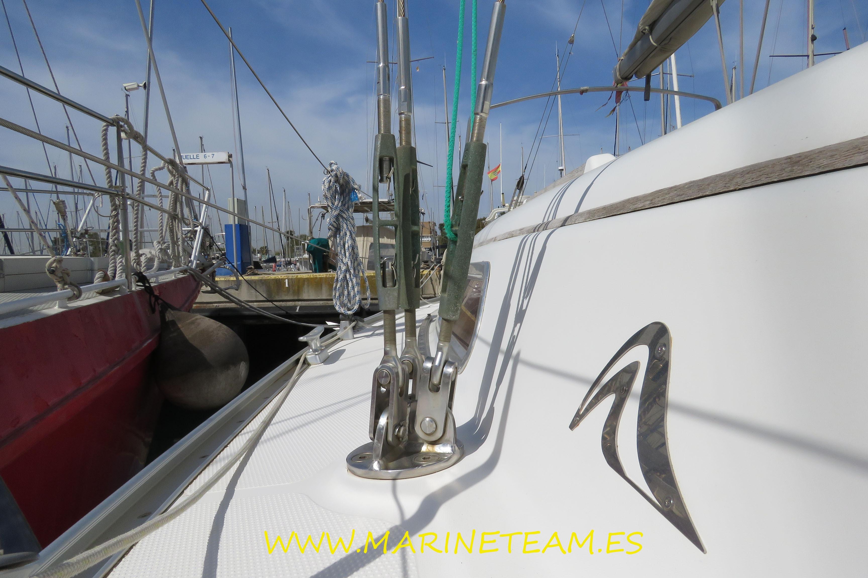 2007 Hanse 342 sailboat docked, featuring deck rigging and logo, with marina background.