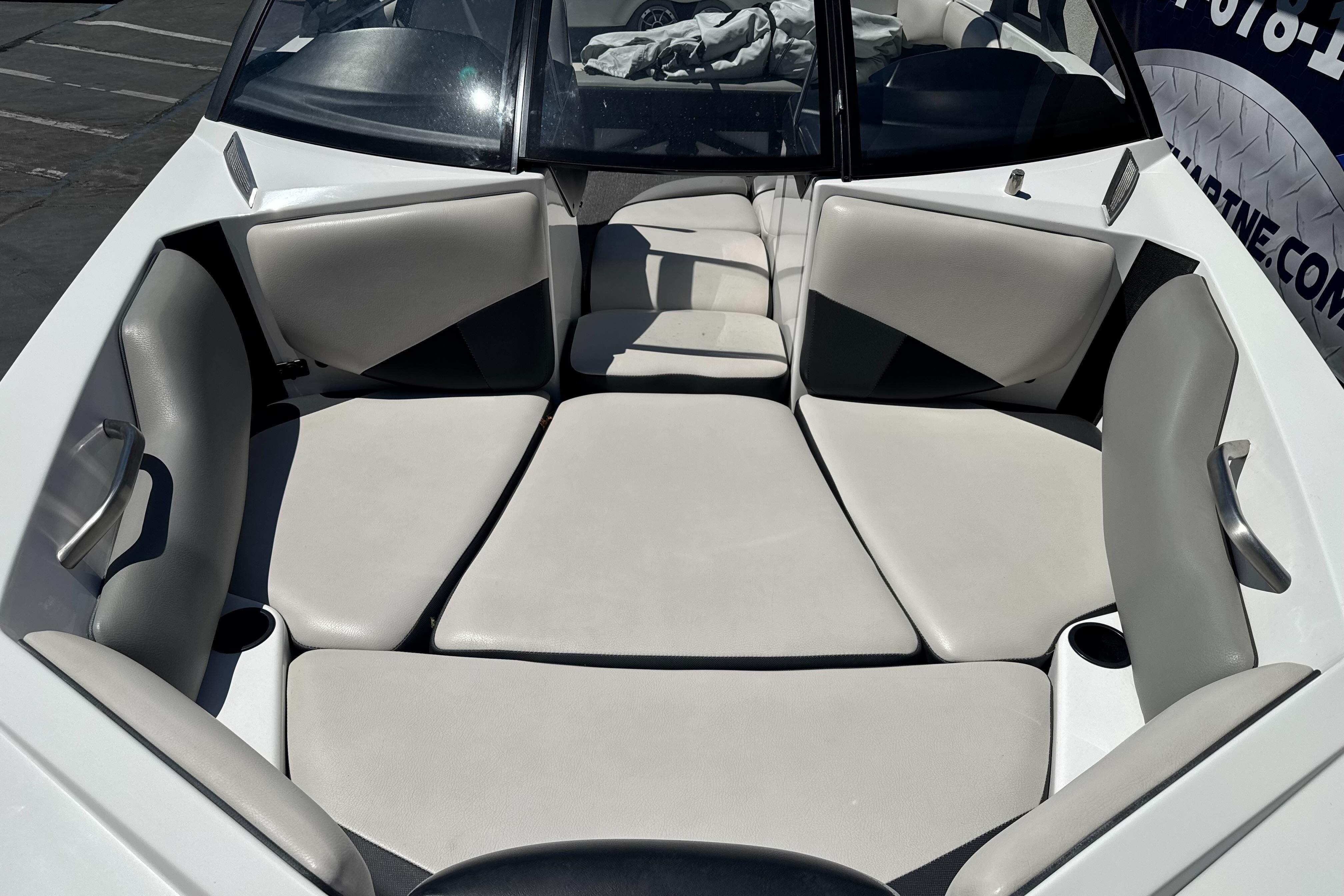 2015 Axis A20 boat interior with gray seating and cup holders.