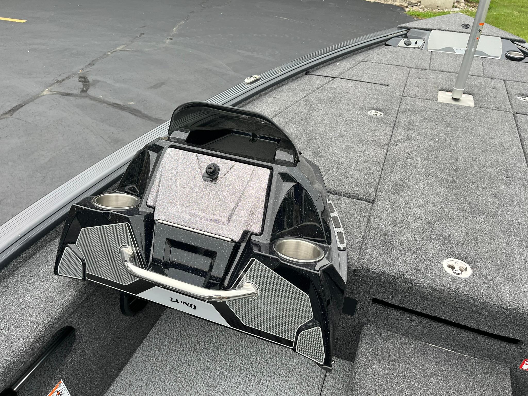 2026 Lund 1875 Pro-V Bass XS boat interior with cup holders and storage compartments.