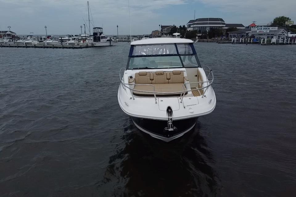 2021 Sea Ray Sundancer 320 Outboard boat docked in a marina.