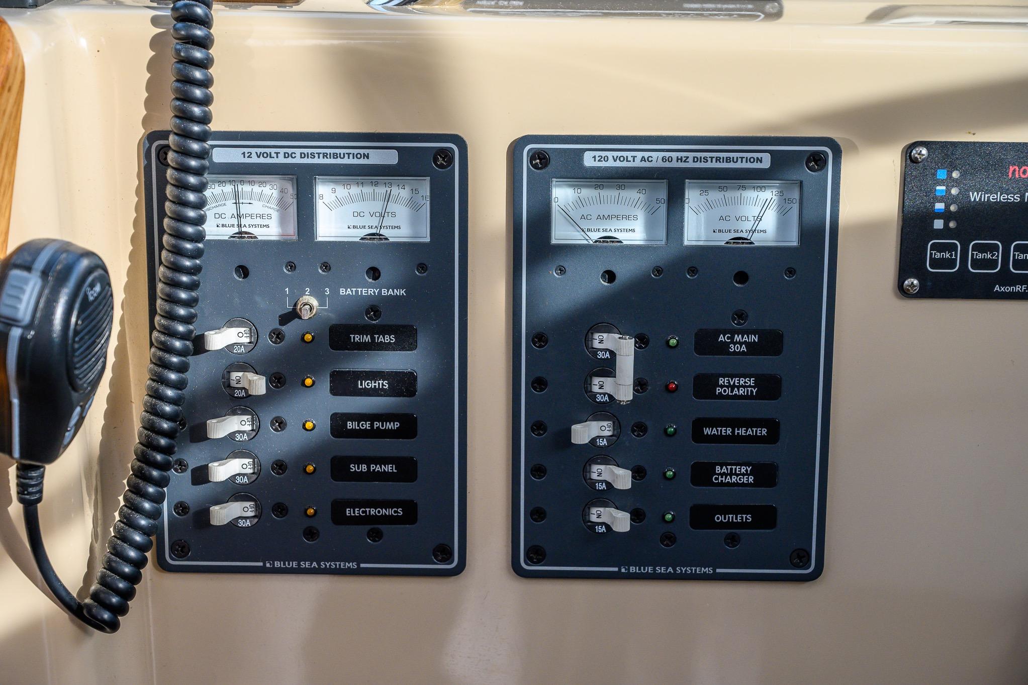 Electrical control panel on a 2012 Aspen C90 boat, featuring Blue Sea Systems components.