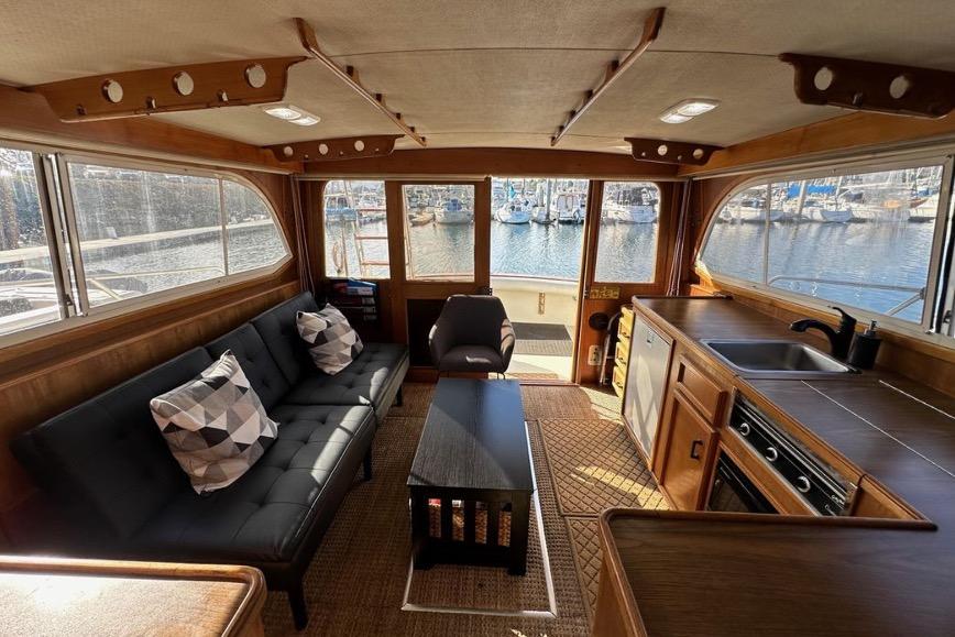 Interior of 1985 Egg Harbor 33 Sedan yacht with modern furnishings and marina view.