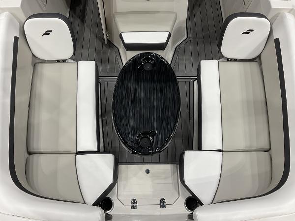 2025 Starcraft SVX 211 OB CC boat interior with sleek seating and oval table.