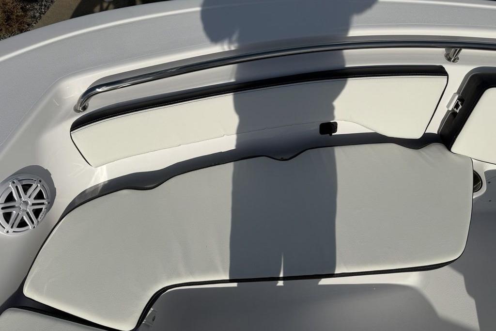 2026 Tidewater 198 CC Adventure boat interior with cushioned seating and speaker.