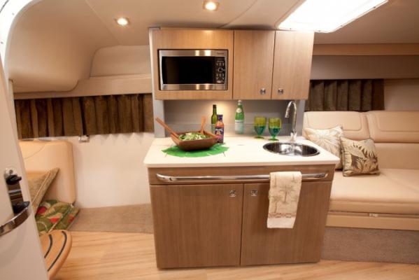 Manufacturer Provided Image: 2013 Formula 350 Sun Sport yacht interior kitchen with microwave, sink, and dining area.