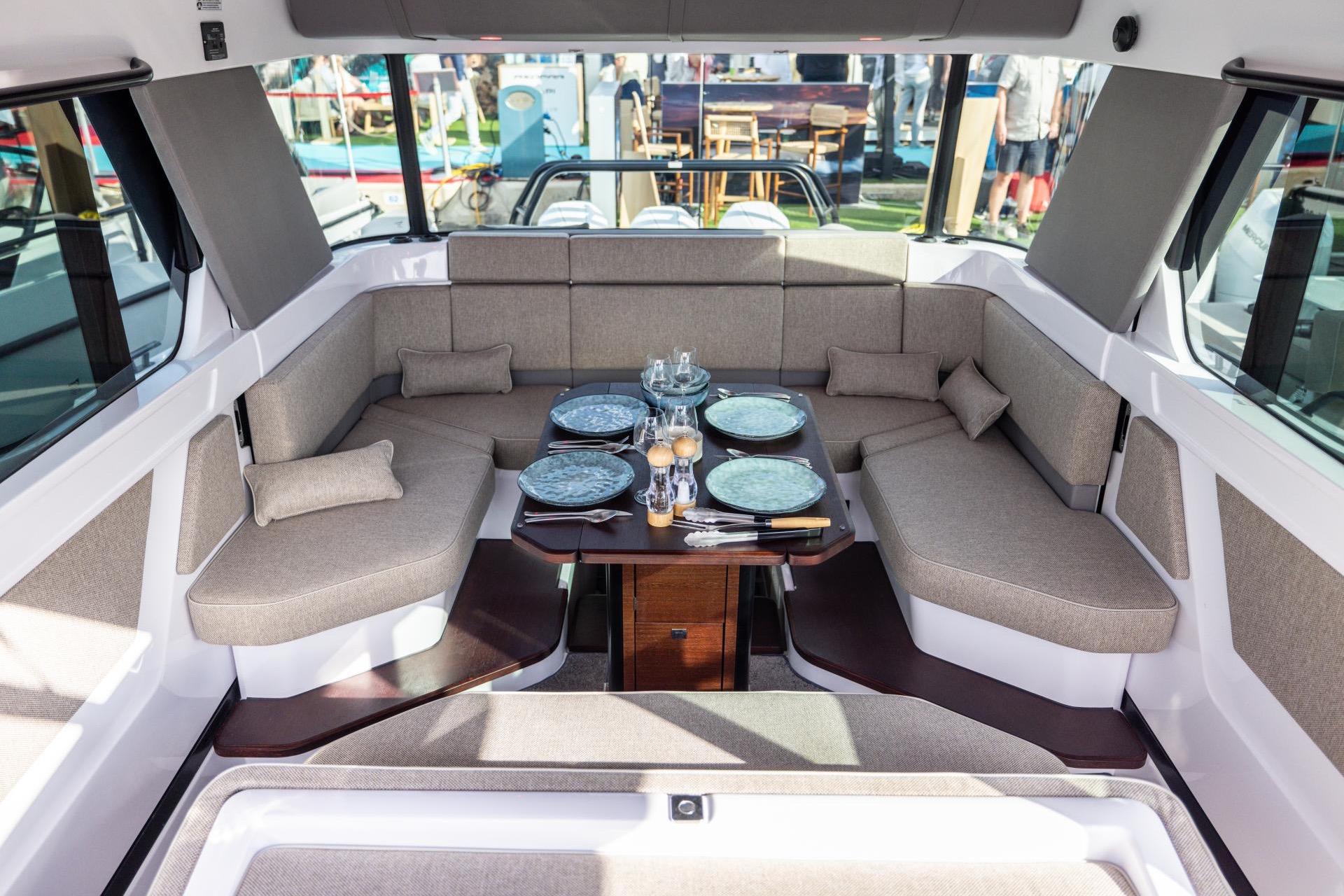 Luxurious interior of 2027 Axopar 45 XC Cross Cabin with elegant dining setup.