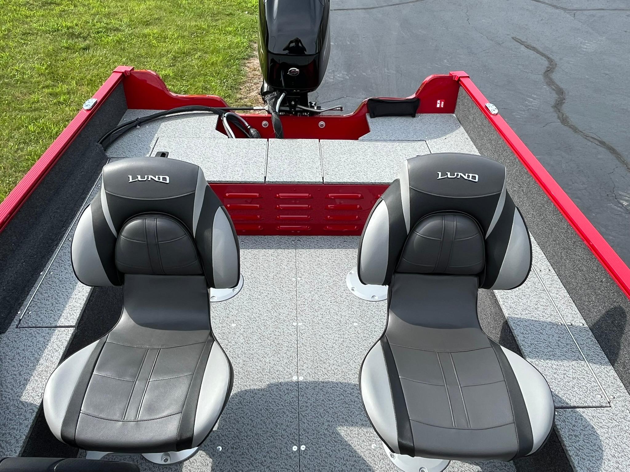 2026 Lund 1650 Angler SS boat interior with two seats and motor.
