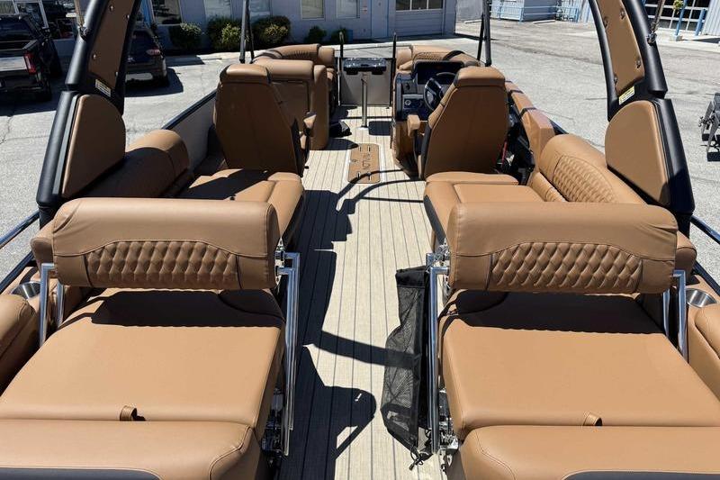 Luxurious 2026 Avalon Excalibur LTD Quad Lounge boat interior with tan seating and spacious layout.