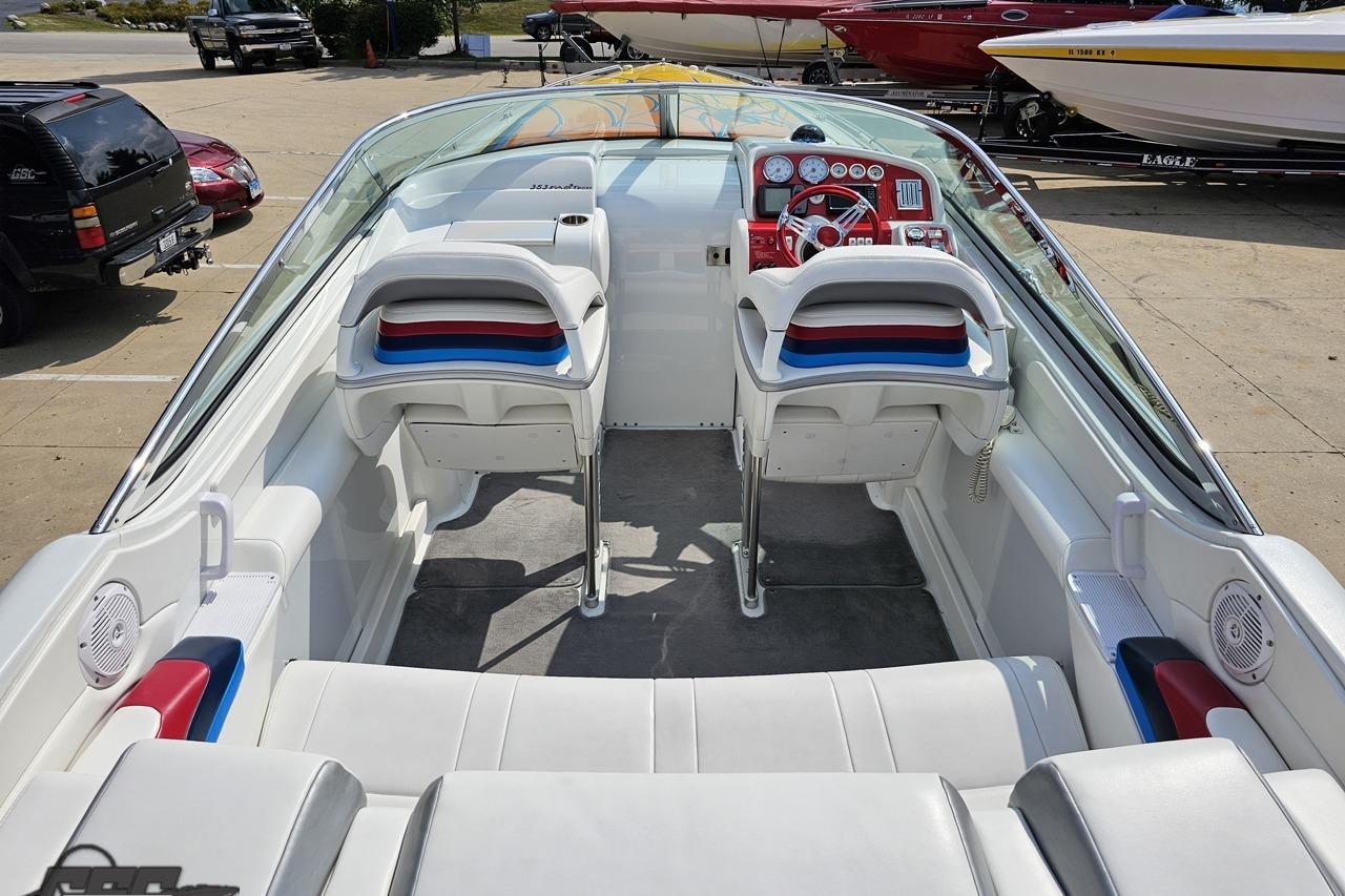 2007 Formula 353 FASTech boat interior with white seating and red dashboard.