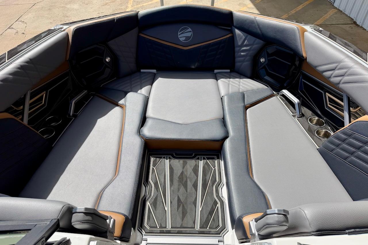 Luxurious interior of 2025 Tigé Ultré 25ZX boat with plush seating and modern design.