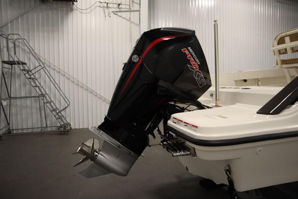 2026 Bayliner Trophy T20CC with Mercury Pro XS outboard motor in a showroom.