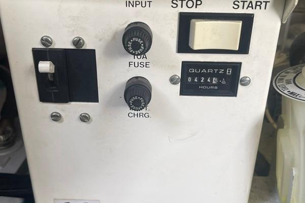 Control panel of a 1999 Formula 400 Super Sport boat with fuse and hour meter.