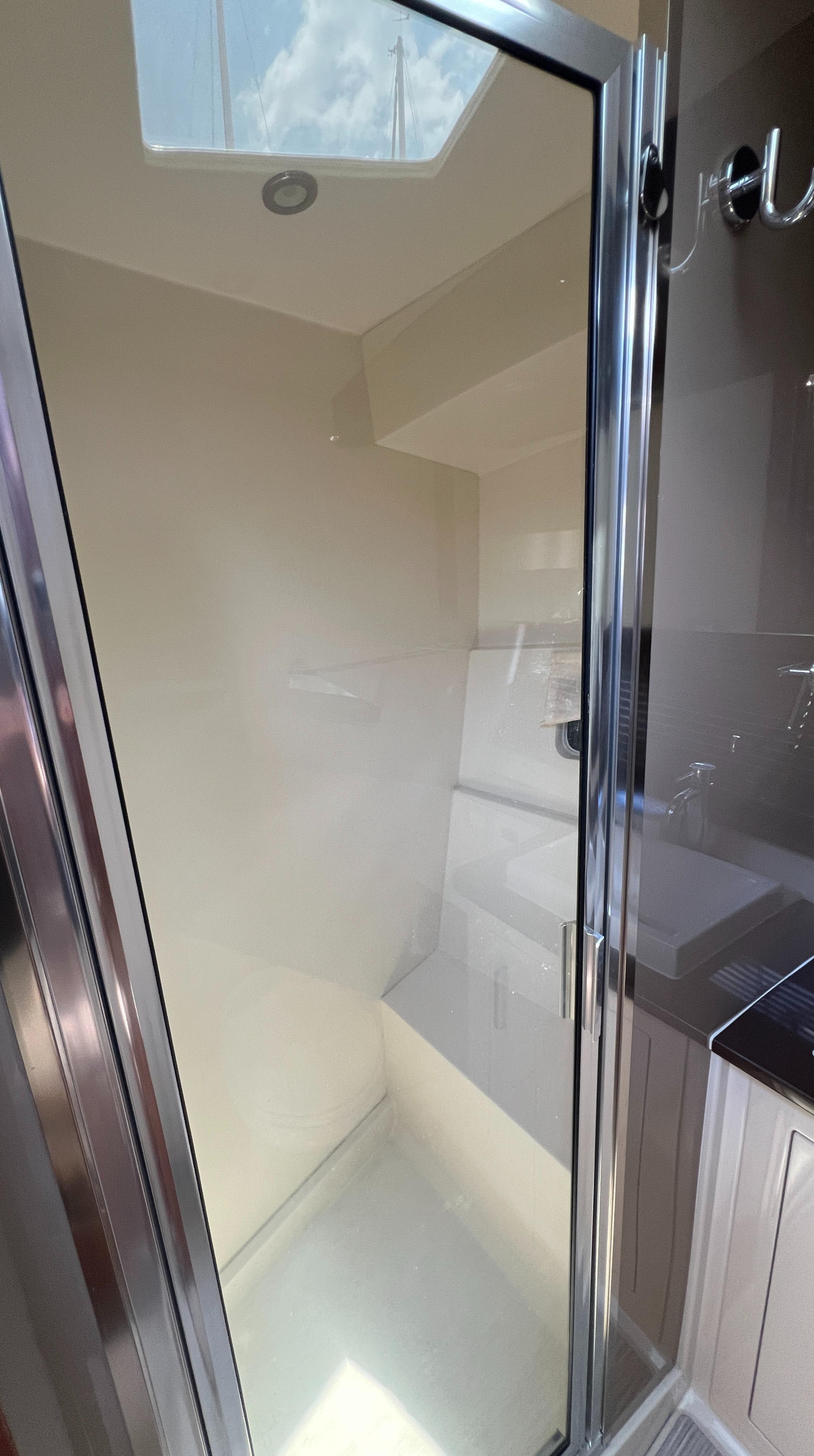 Shower area in 2016 Carver C34 Command Bridge yacht with skylight.