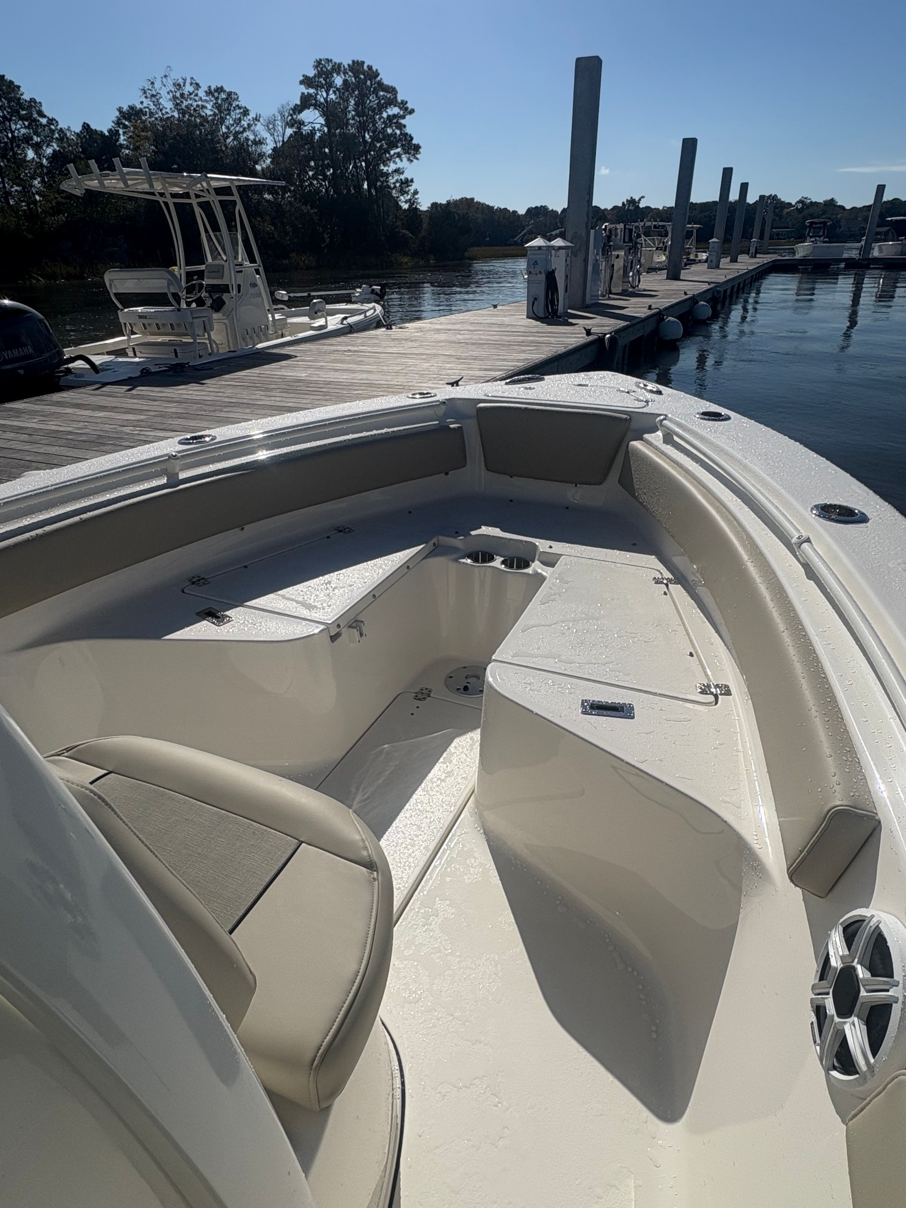 The image shows the bow of a Key West 239 FSR boat docked on a sunny day.