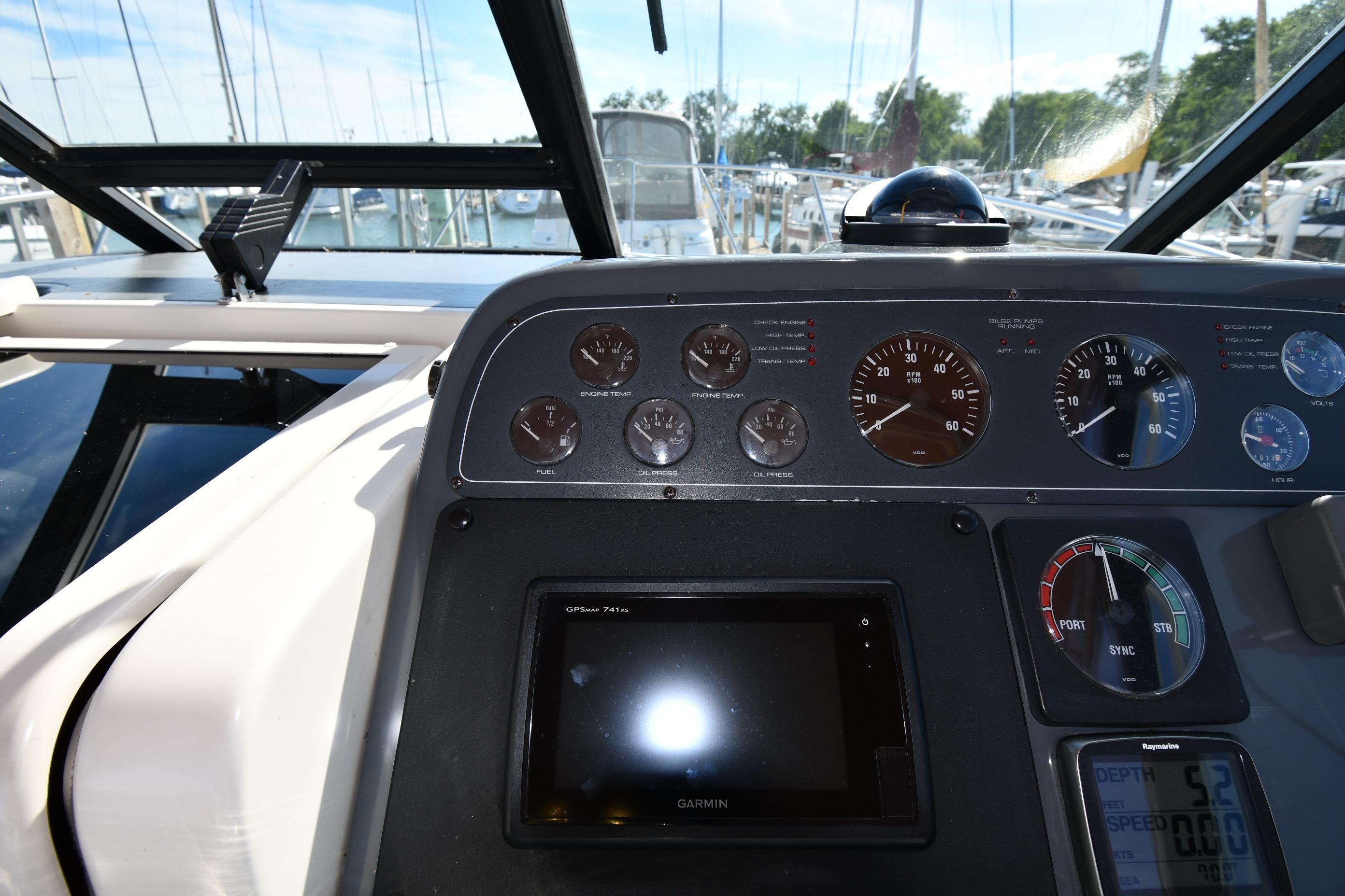 1998 Tiara Yachts 3100 Open dashboard with gauges and Garmin GPS display.