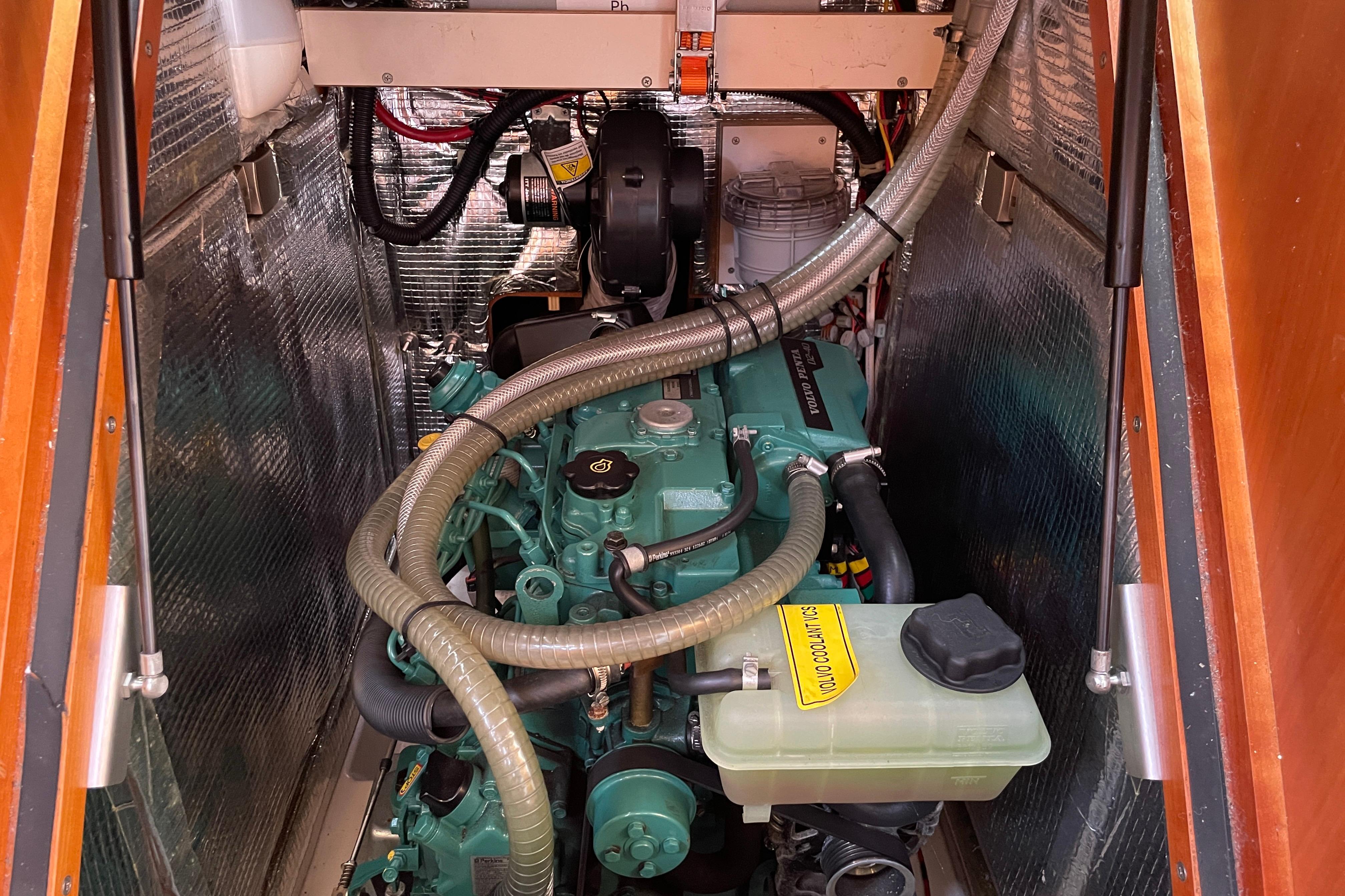Engine compartment of a 2014 Hanse 415 sailboat, featuring a well-maintained motor.