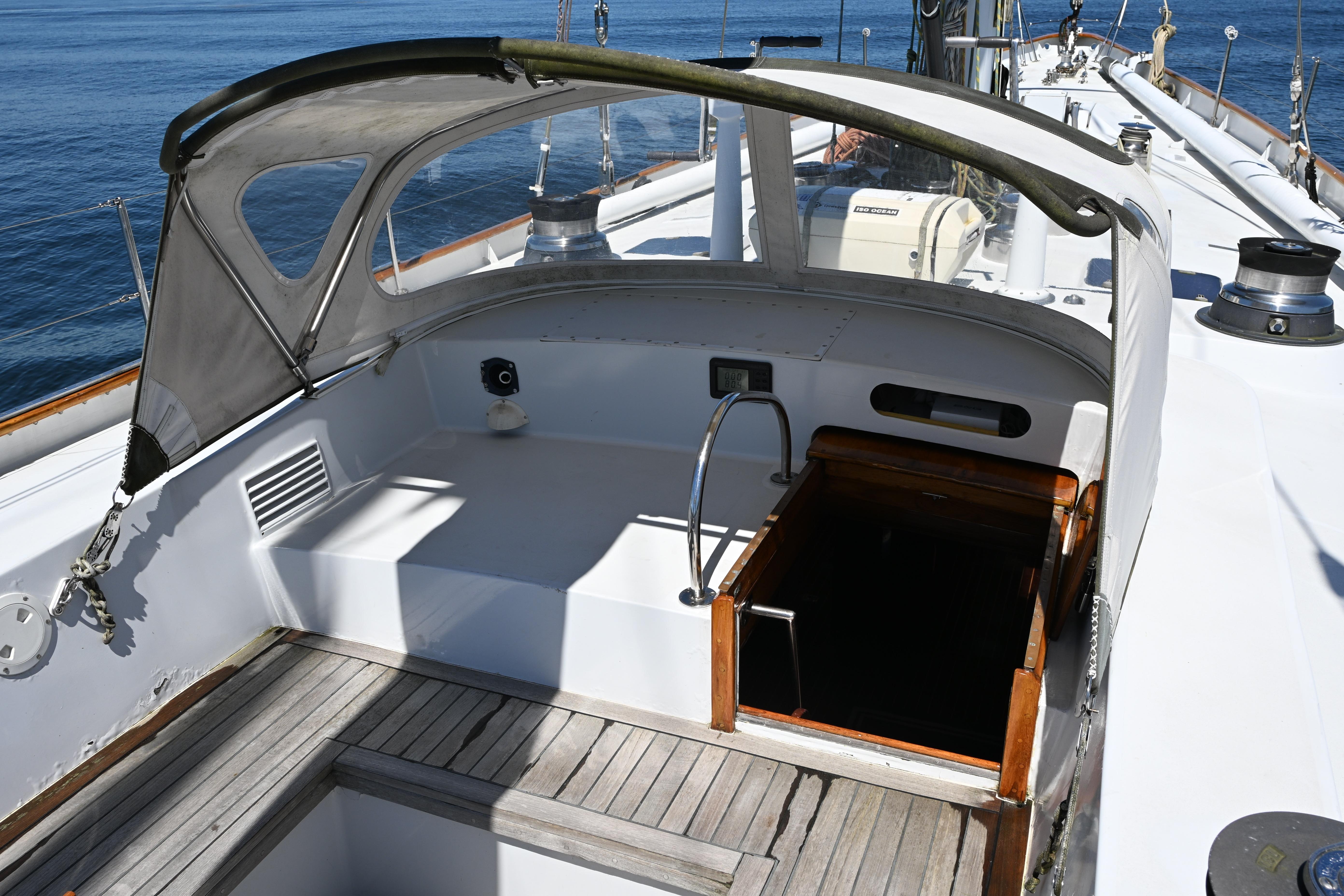 Cockpit of 1968 Abeking & Rasmussen Tripp 74 yacht with open hatch and canopy.