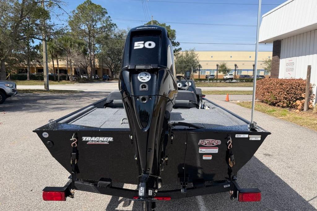 2026 Tracker Bass Tracker Classic XL boat with a 50 HP engine, parked outdoors.